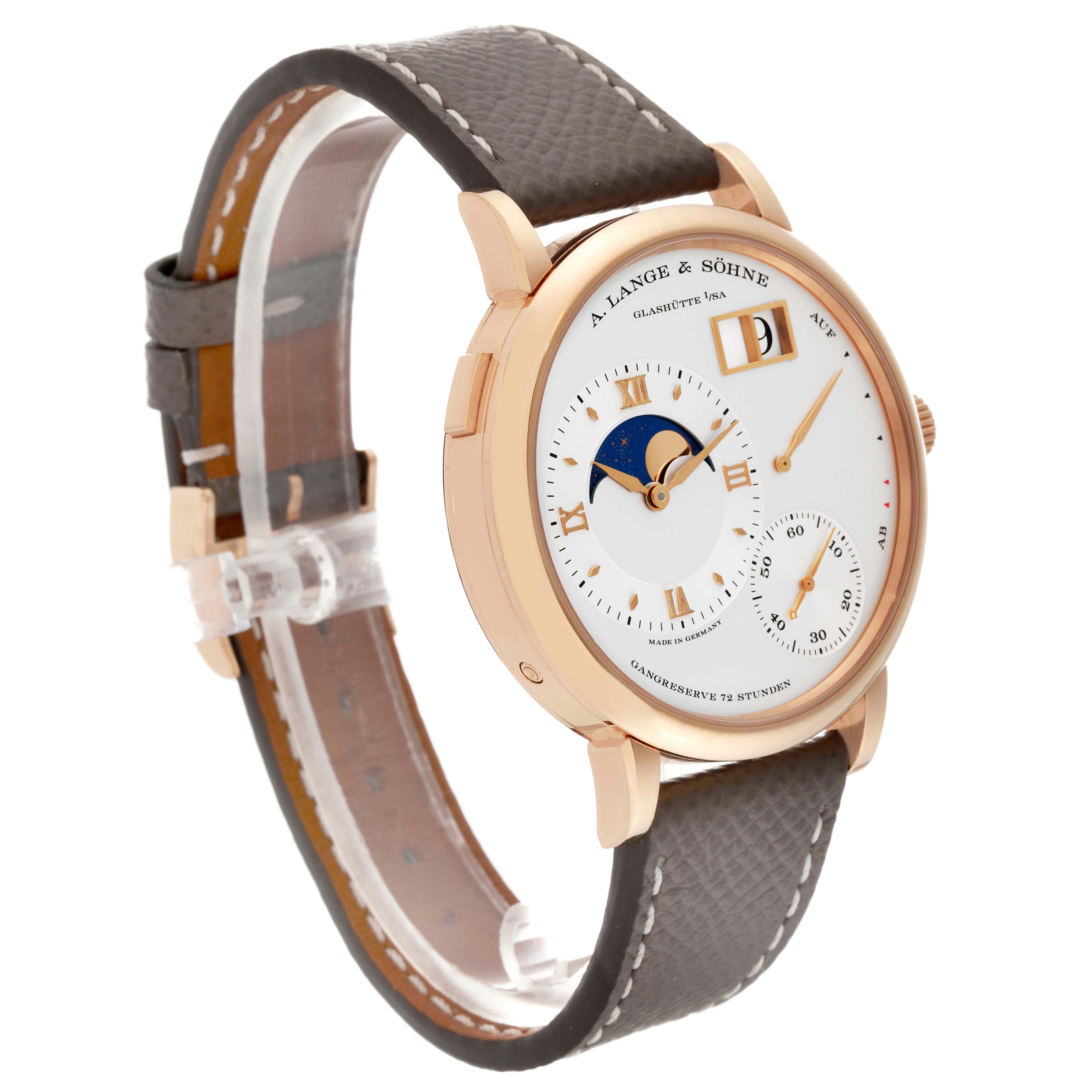 The A. Lange & Sohne Lange 1 139.032 Men's Rose Gold Silver Dial is shown at a three-quarter angle, highlighting the dial, moon phase, and leather strap.