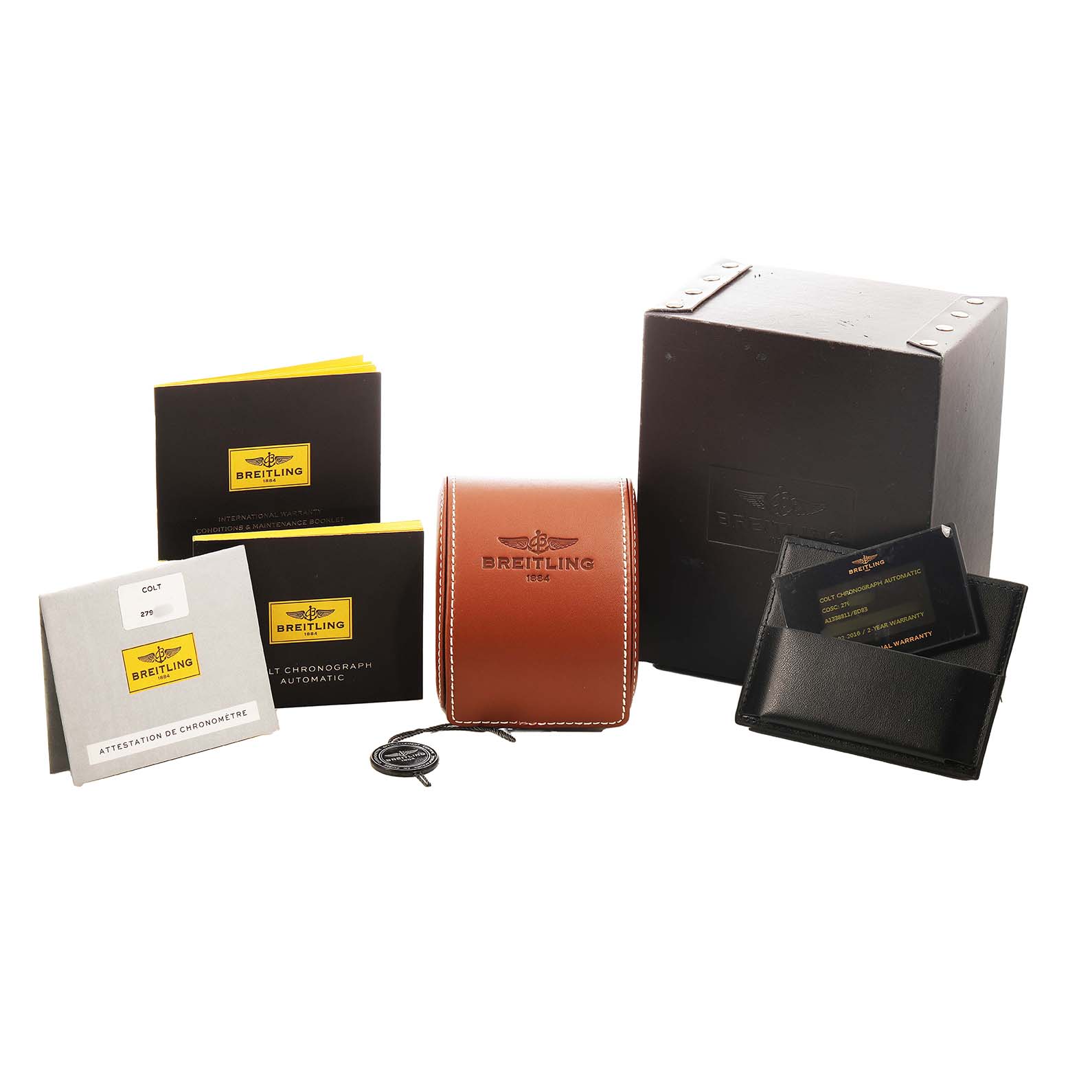 The image shows Breitling Colt A1338811/BD83 Men's Stainless Steel Black Dial accessories, including a box, case, manuals, and warranty cards, viewed from the front angle.