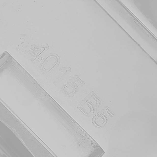 The image shows a close-up of an engraving on a part of the Breitling Colt A1338811/BD83 Men's Stainless Steel Black Dial watch accessory.