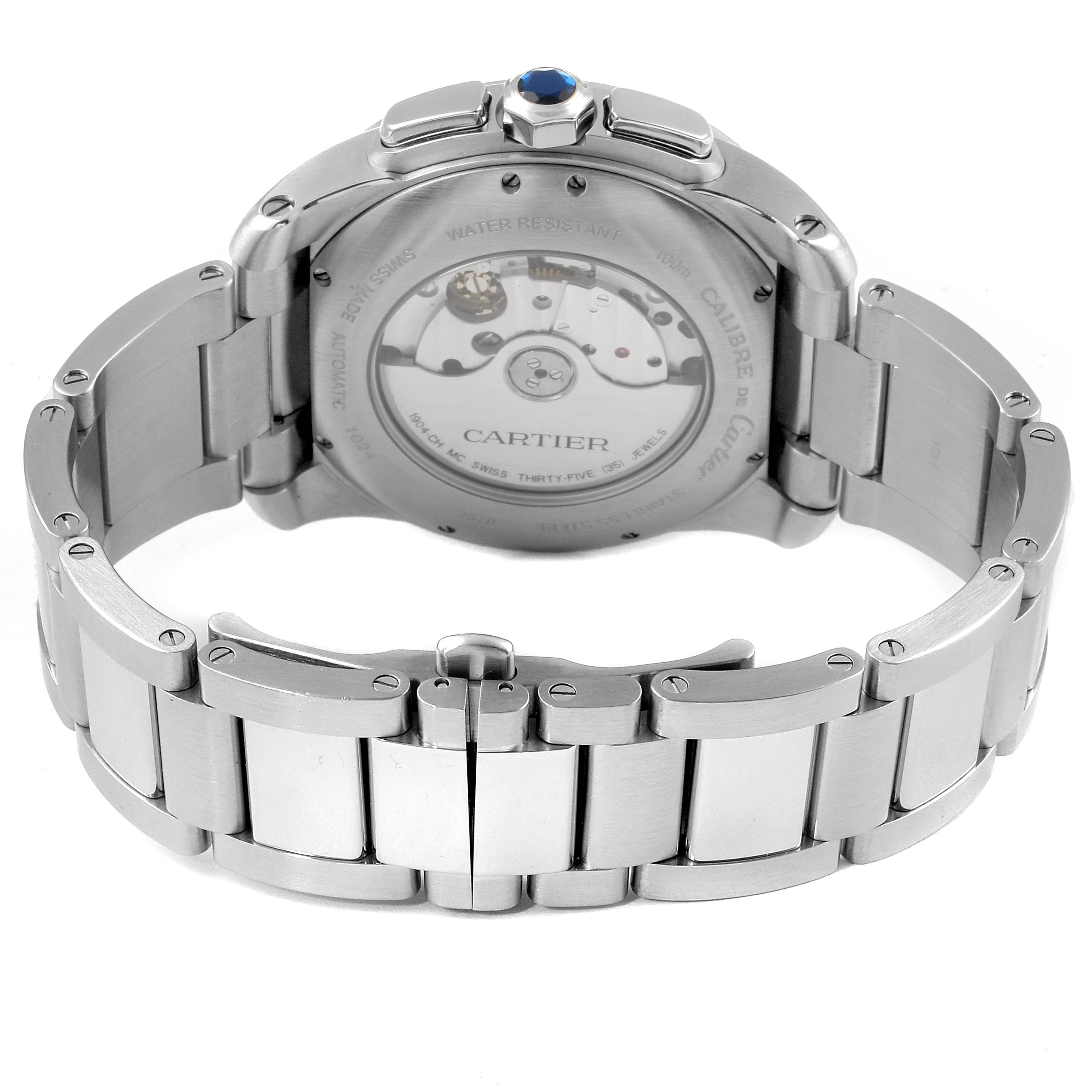 This image shows the back of a Calibre de Cartier watch by Cartier, featuring its clasp and visible movement components.
