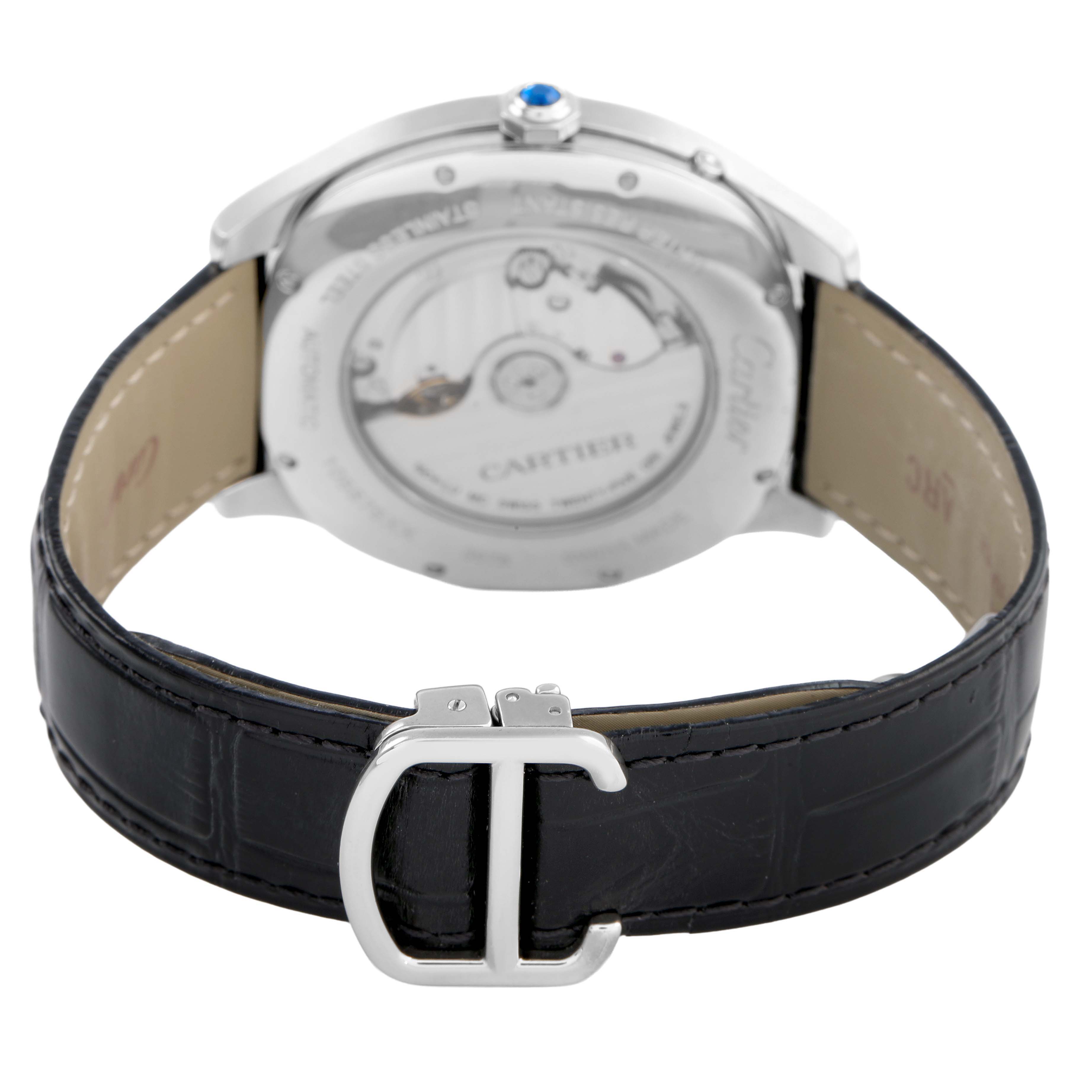 The image shows the back of the Drive de Cartier watch by Cartier, highlighting its transparent case back and black leather strap with a silver buckle.