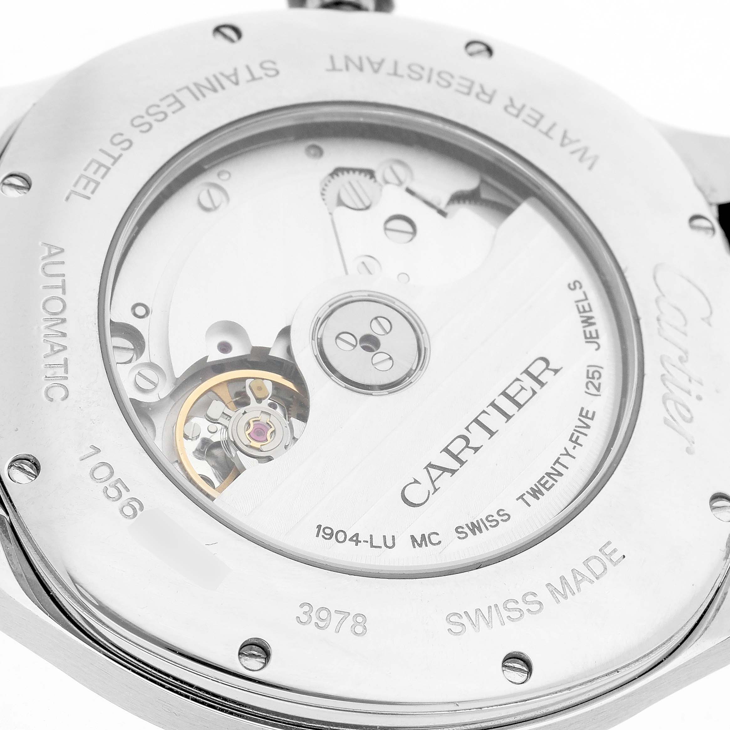 The image shows the back of a Drive de Cartier watch, highlighting the movement and engravings like "Cartier" and technical details.