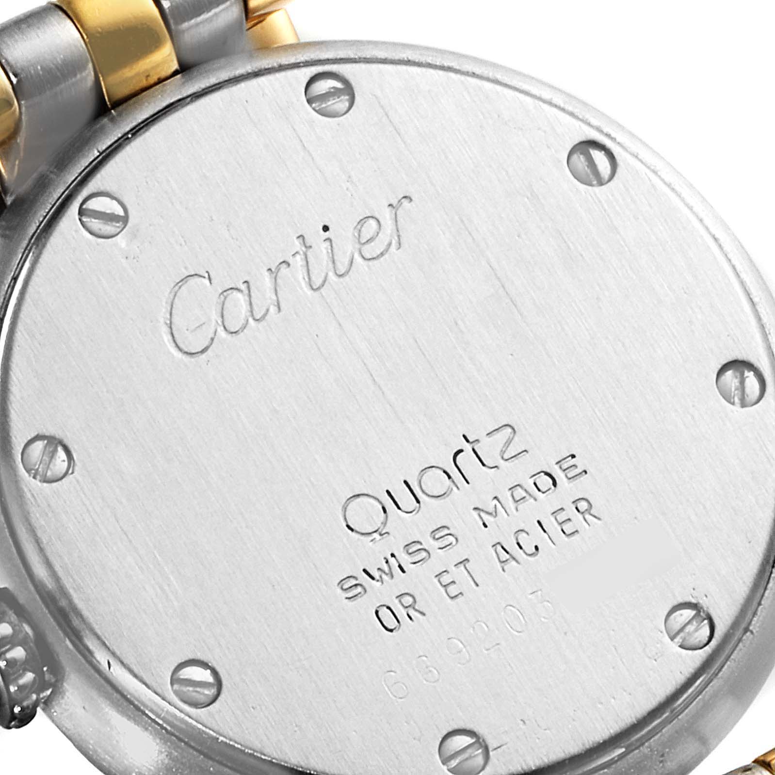 This image shows the back casing of a Cartier Panthere 66920 Women's Steel and Gold (two tone) Silver Dial 66920 Women's Steel and Gold (two tone) Silver Dial watch along with part of its bracelet.