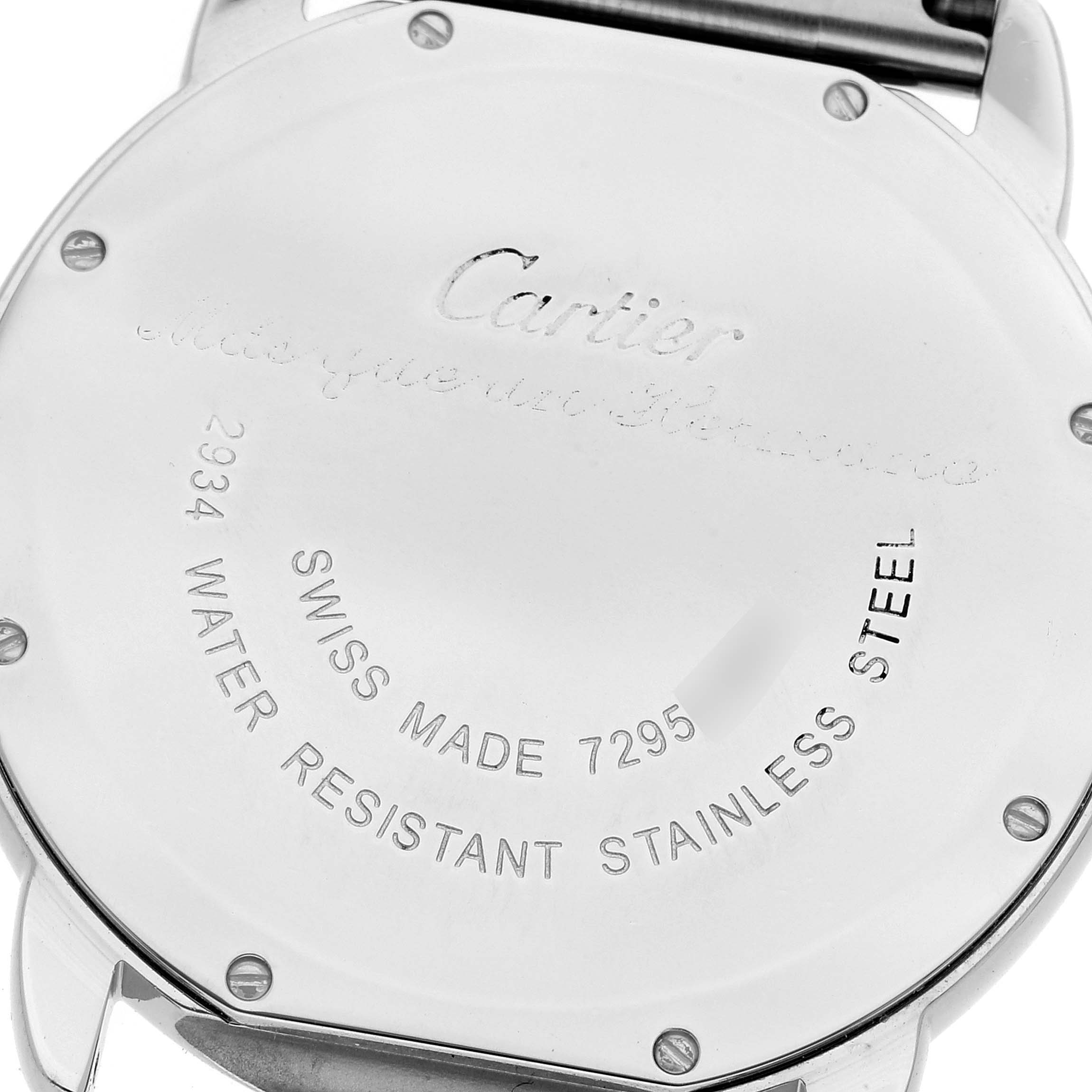 The image shows the back case of a Ronde model watch by Cartier, highlighting its engravings and screws.