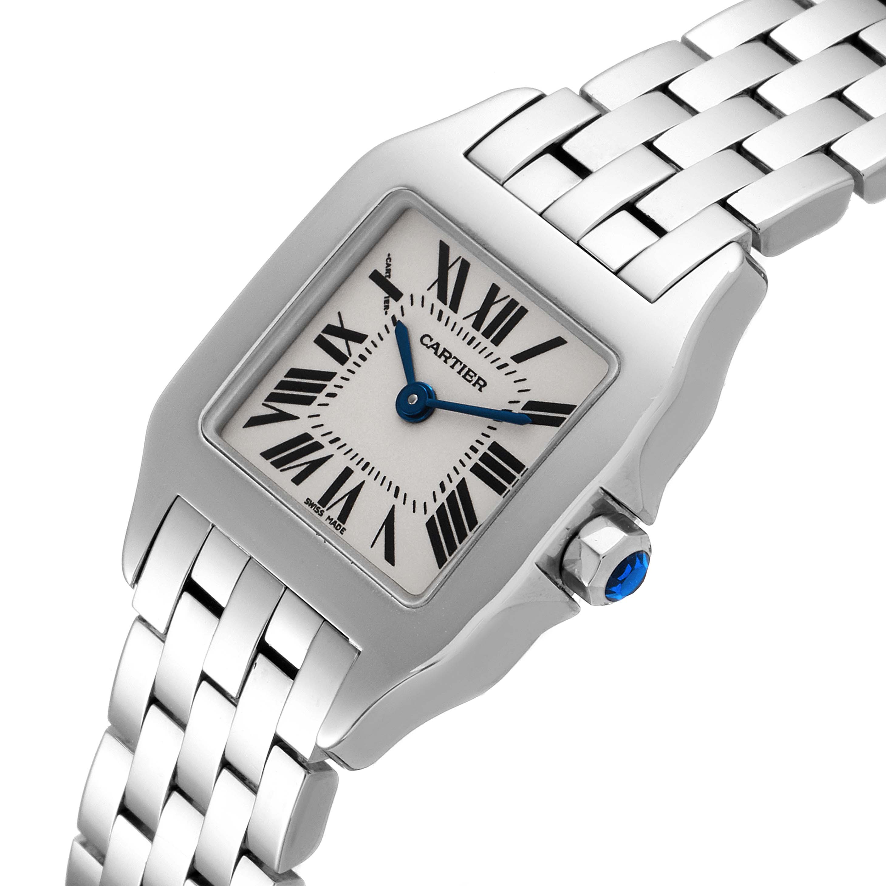 The Cartier Santos Demoiselle W25064Z5 Women
s Stainless Steel Silver Dial W25064Z5 Women
s Stainless Steel Silver Dial watch is shown from a front angle, featuring the face, bezel, part of the bracelet, and crown.