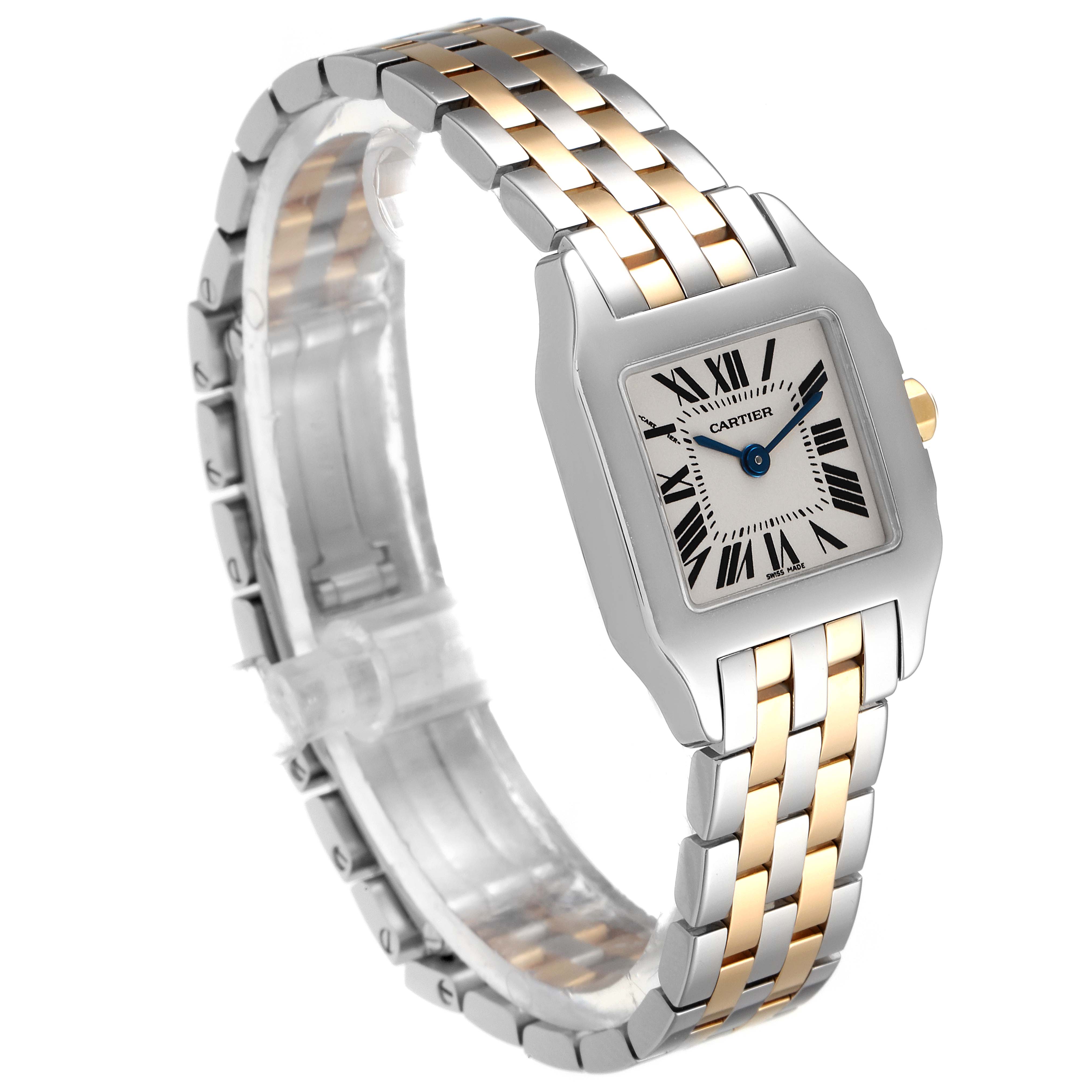 The image shows a Cartier Santos Demoiselle W25066Z6 Women
s Steel and Gold (two tone) Silver Dial W25066Z6 Women
s Steel and Gold (two tone) Silver Dial watch at a three-quarter angle, highlighting its face, bracelet, and clasp.