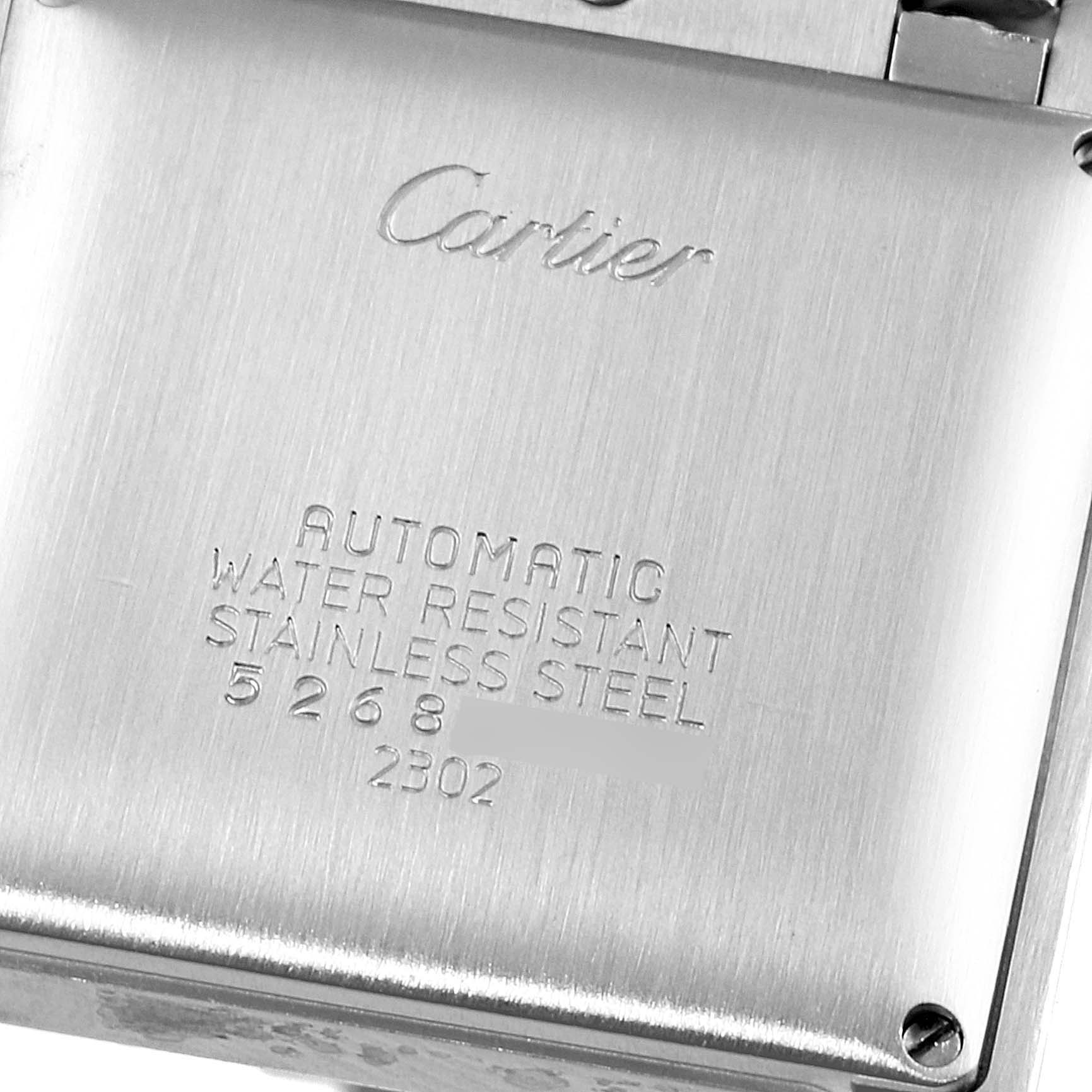 The image shows the back case of a Cartier Tank Francaise W51002Q3 Men's Stainless Steel Silver Dial W51002Q3 Men's Stainless Steel Silver Dial watch, displaying engravings and screws.