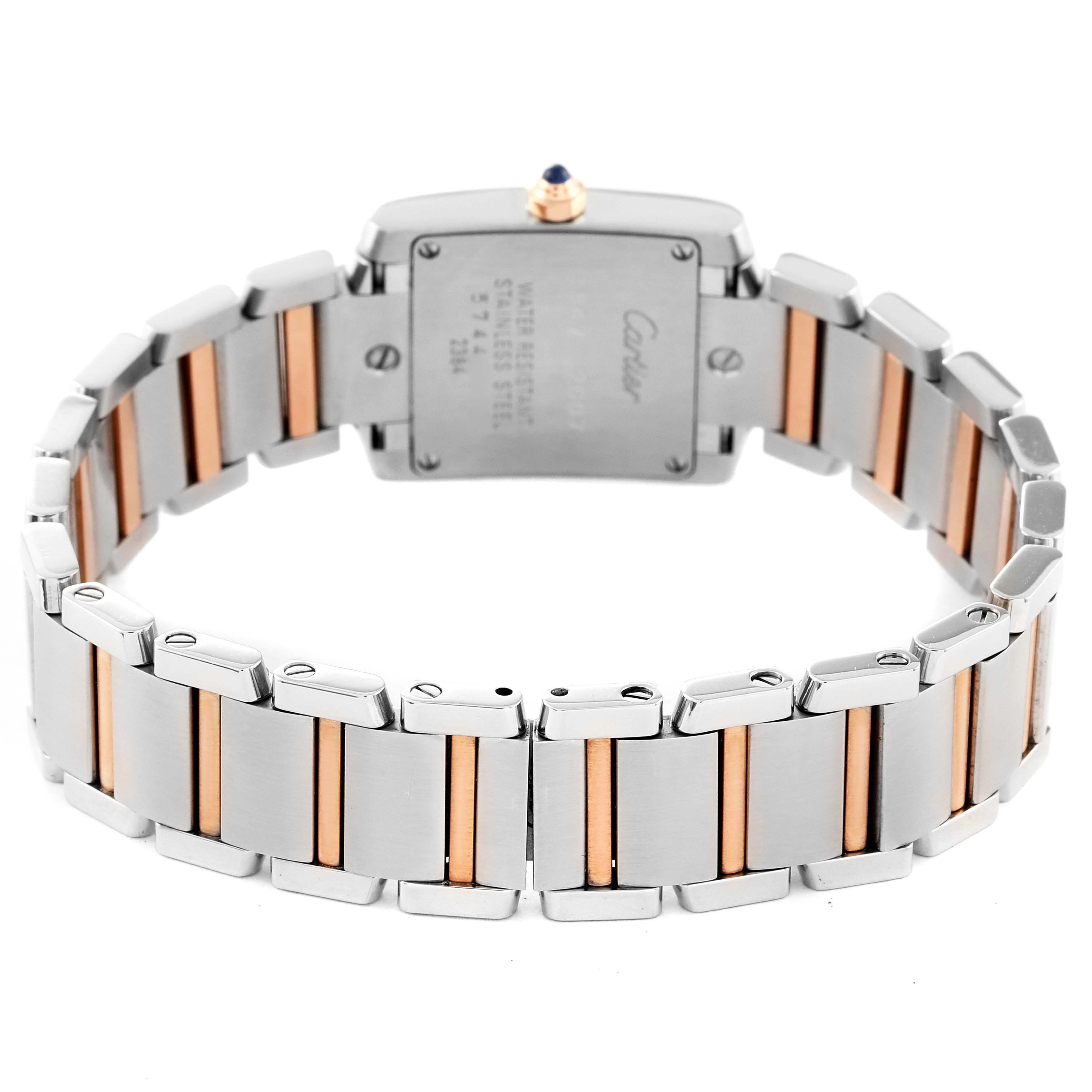 This image shows the back view of the Cartier Tank Française watch, highlighting its two-tone metal bracelet and case back.