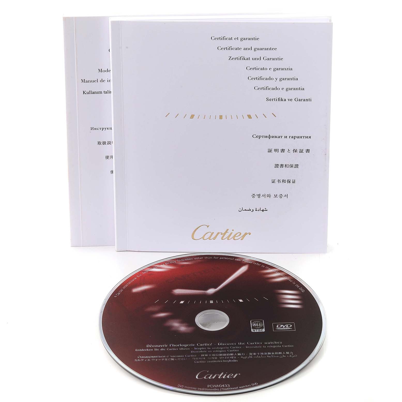 The image shows the Cartier Tank Francaise W51036Q4 Women's Steel and Gold (two tone) Silver Dial W51036Q4 Women's Steel and Gold (two tone) Silver Dial model's certificate booklet and an accompanying DVD from an overhead angle.