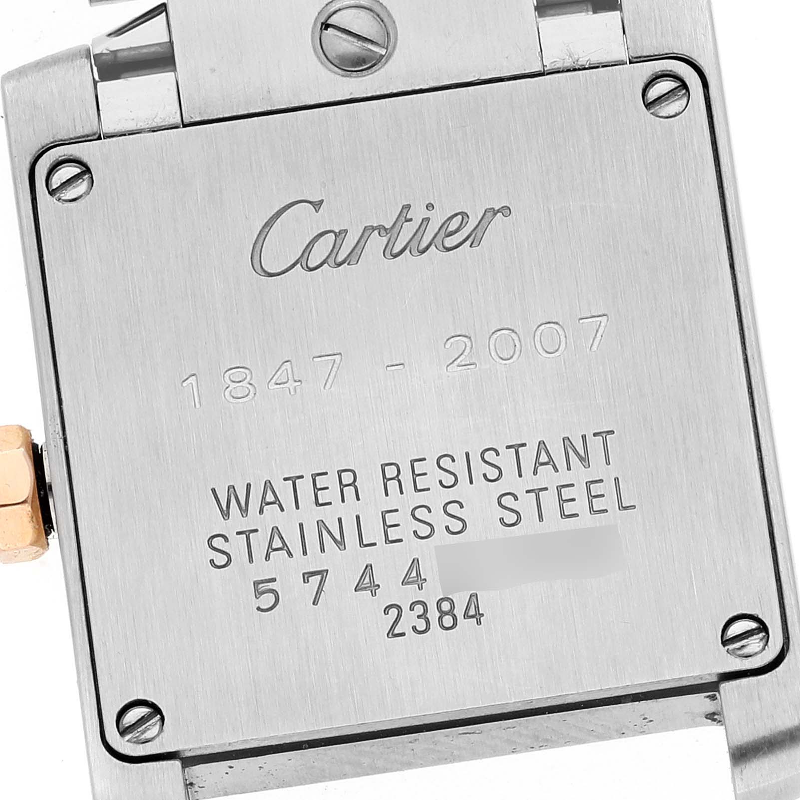 The image shows the back plate of a Cartier Tank Francaise W51036Q4 Women's Steel and Gold (two tone) Silver Dial W51036Q4 Women's Steel and Gold (two tone) Silver Dial watch, highlighting the engraved details and water resistance information.
