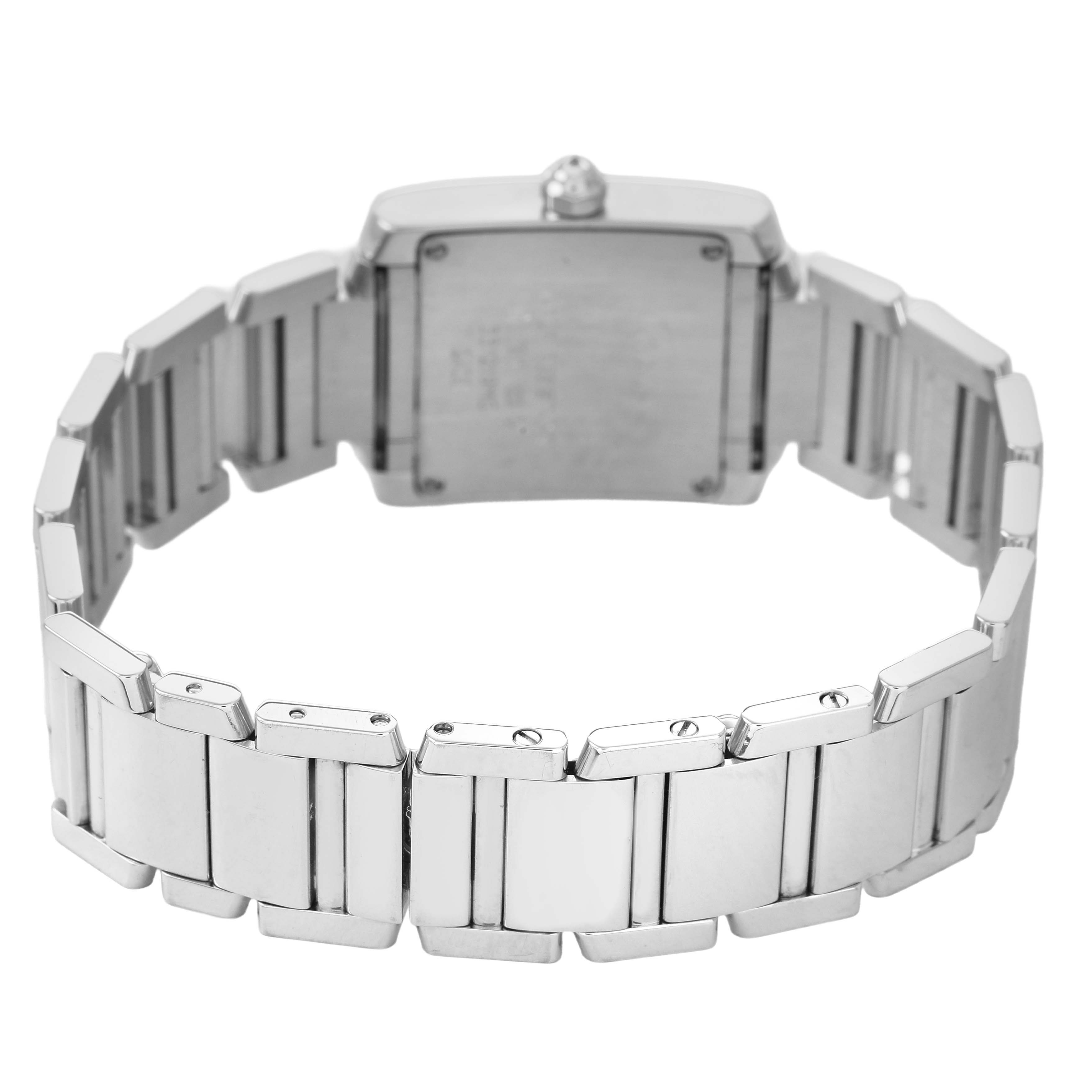 The image shows the back view of a Cartier Tank Française watch, focusing on the bracelet and case back.