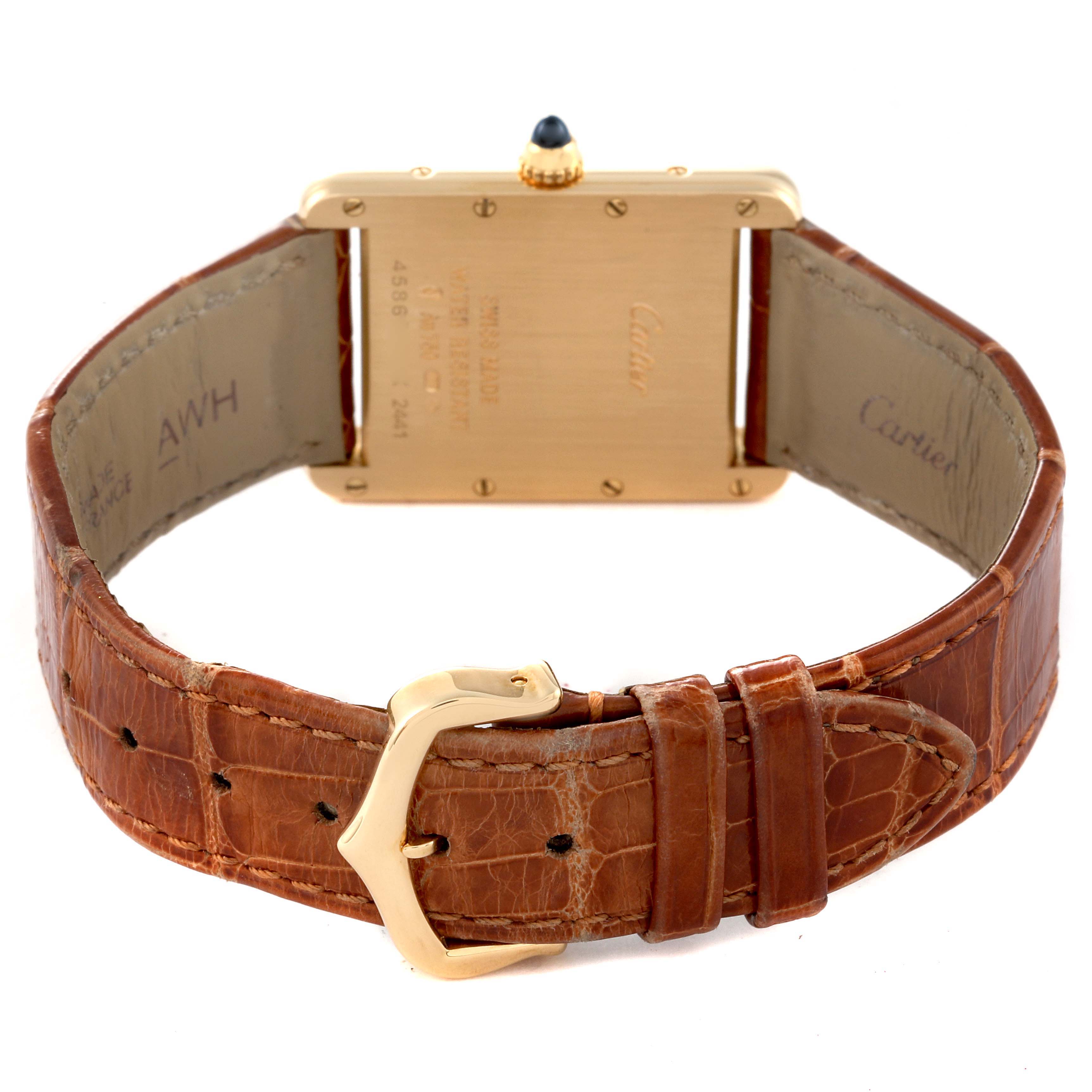 The image shows the back view of a Cartier Tank Louis W1529756 Men
s Yellow Gold Silver Dial W1529756 Men
s Yellow Gold Silver Dial watch, featuring its brown leather strap and gold buckle.