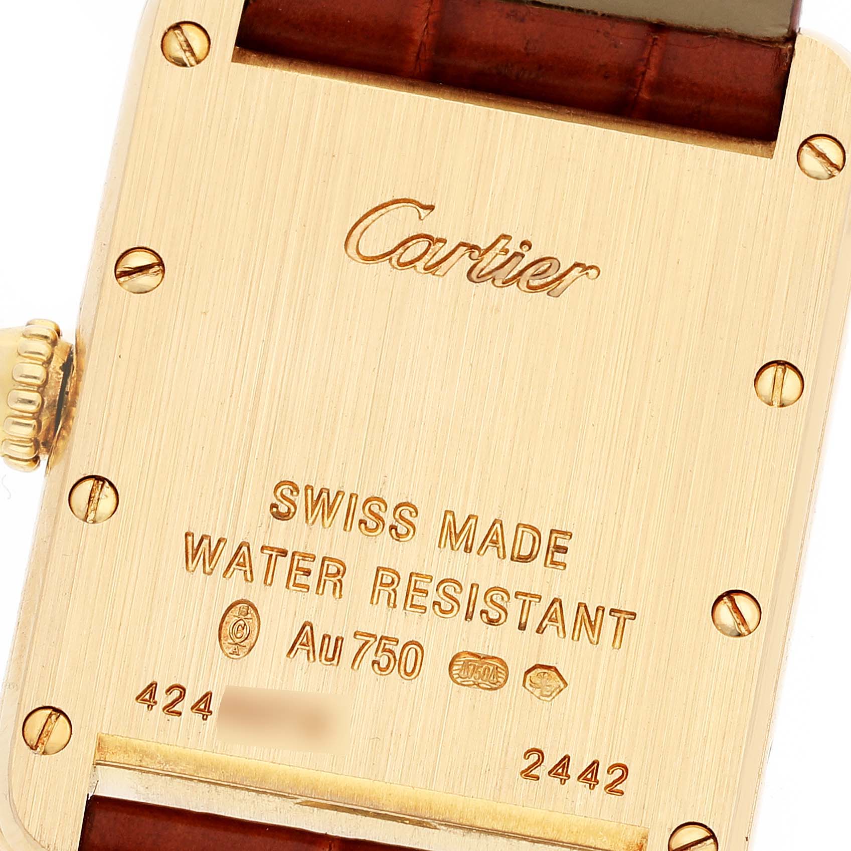This image shows the backcase of a Cartier Tank Louis W1529856 Women's Yellow Gold Silver Dial W1529856 Women's Yellow Gold Silver Dial watch, highlighting its engravings and screws.