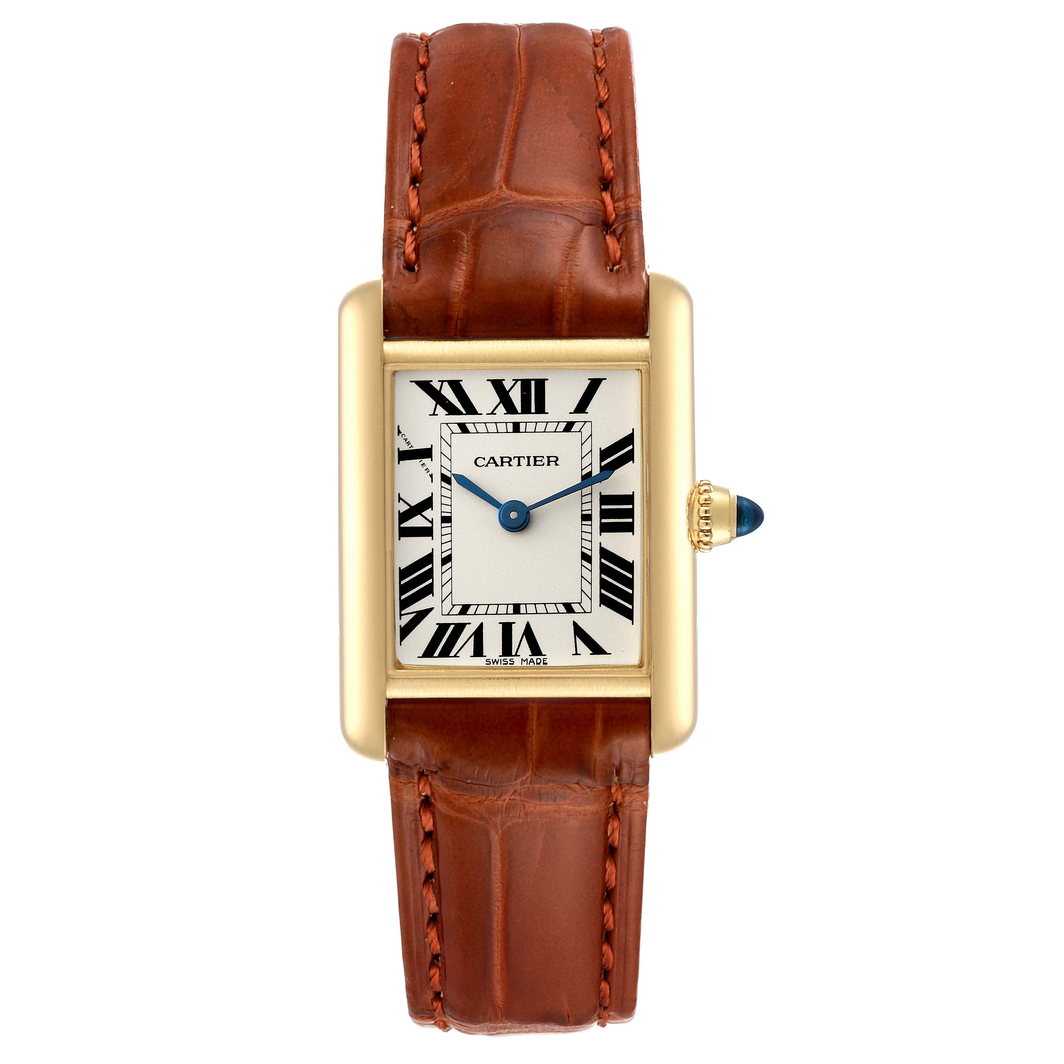 The Tank Louis Cartier watch is shown from a front angle, displaying its rectangular face, brown leather strap, and gold crown with a blue cabochon.
