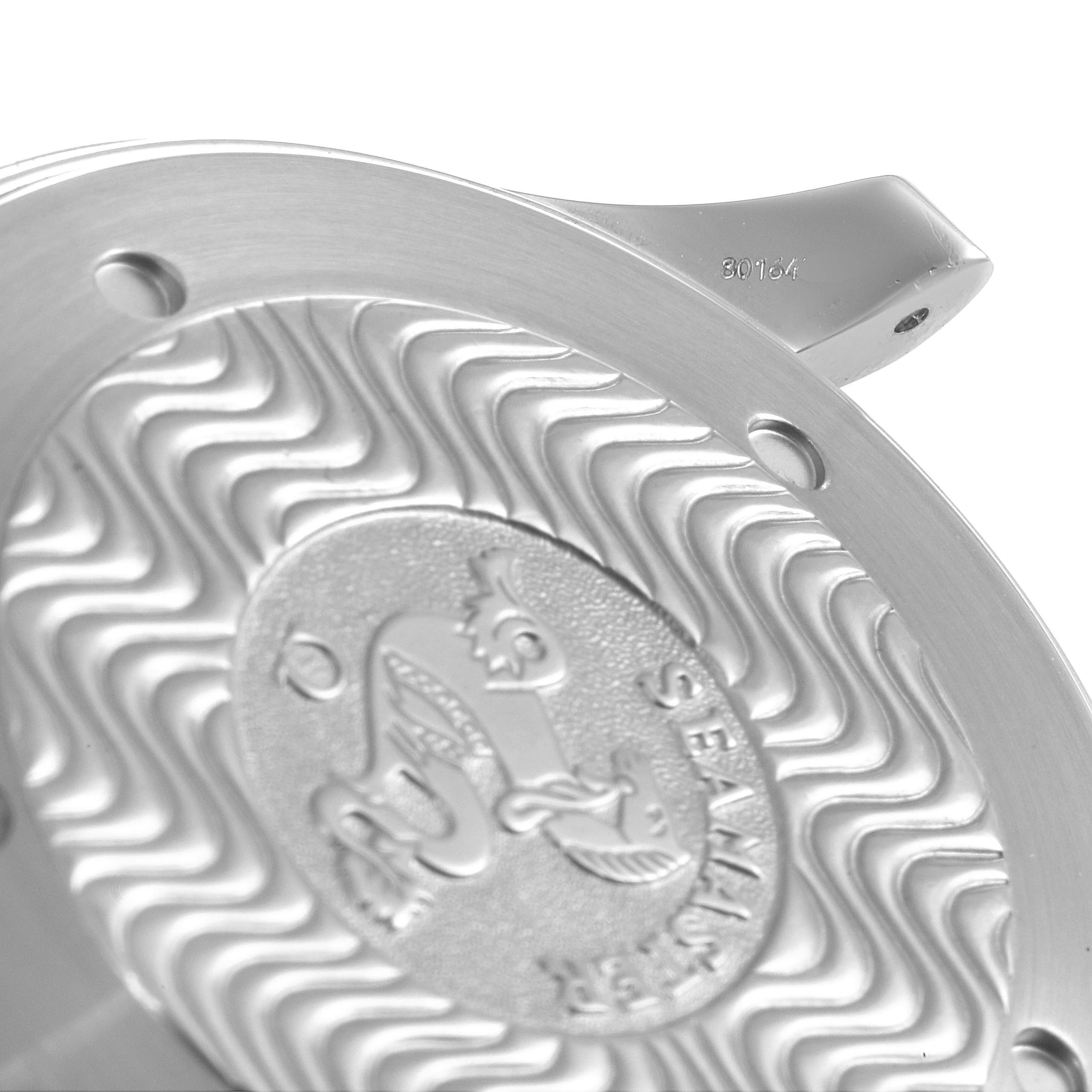 This image shows a close-up of the case back of the Omega Seamaster 2254.50.00 Men
s Stainless Steel Black Dial 2254.50.00 Men
s Stainless Steel Black Dial watch, featuring an embossed design.