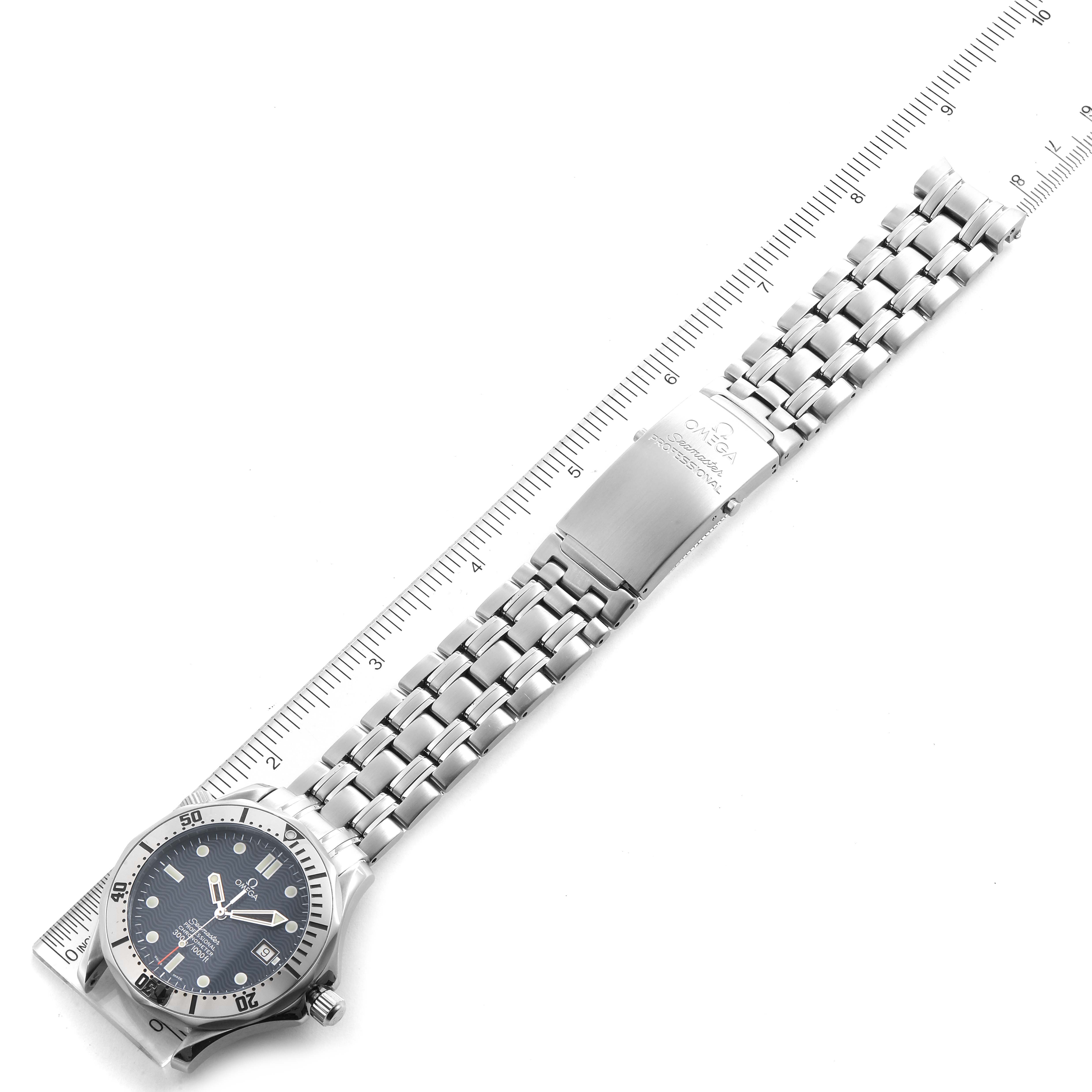 The image shows an Omega Seamaster 2532.80.00 Men
s Stainless Steel Blue Dial 2532.80.00 Men
s Stainless Steel Blue Dial watch laid flat with its metal band extended and positioned alongside a ruler for measurement.