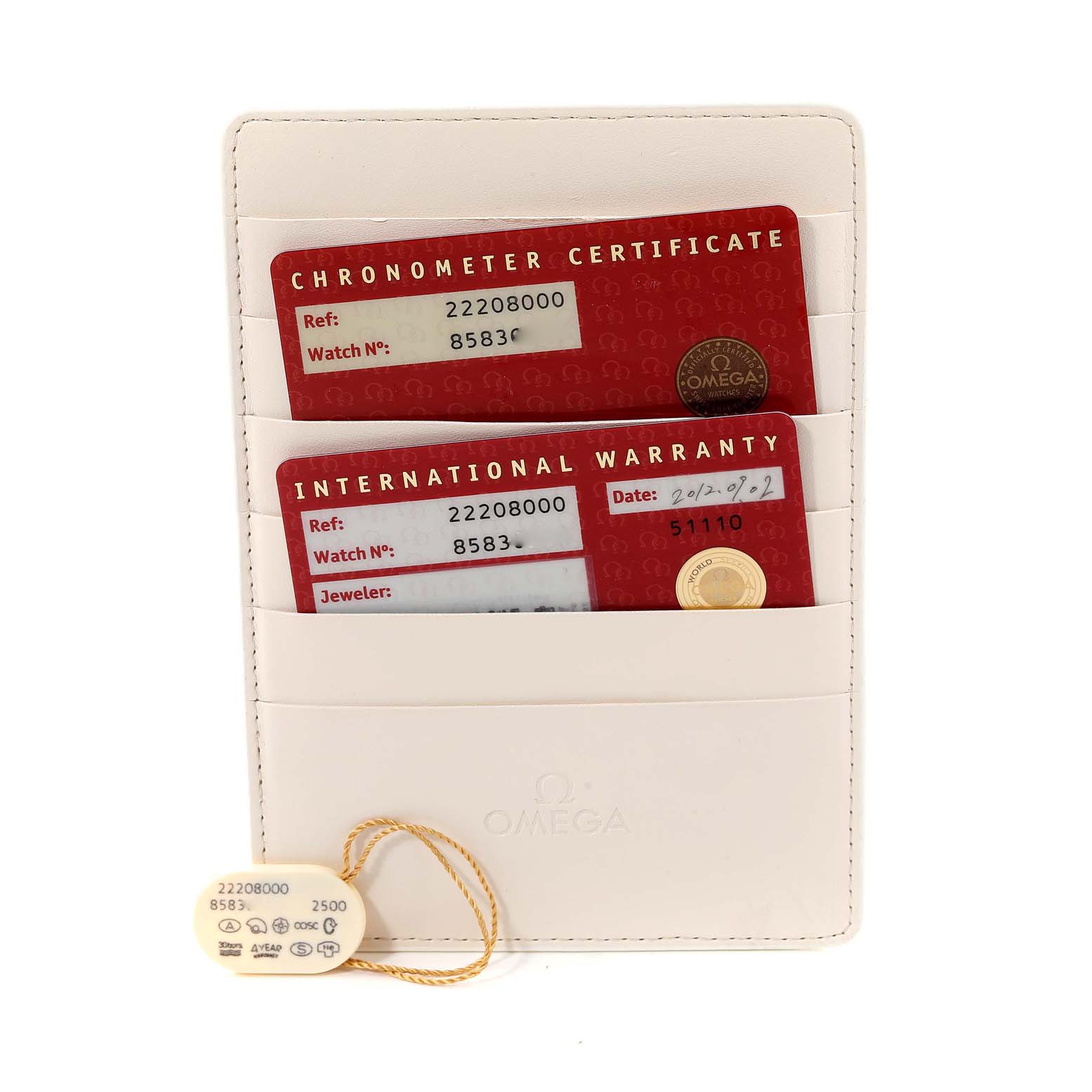 The image shows the chronometer certificate, international warranty card, and tag for an Omega Seamaster 2220.80.00 Men's Stainless Steel Blue Dial 2220.80.00 Men's Stainless Steel Blue Dial watch from a top-down perspective.