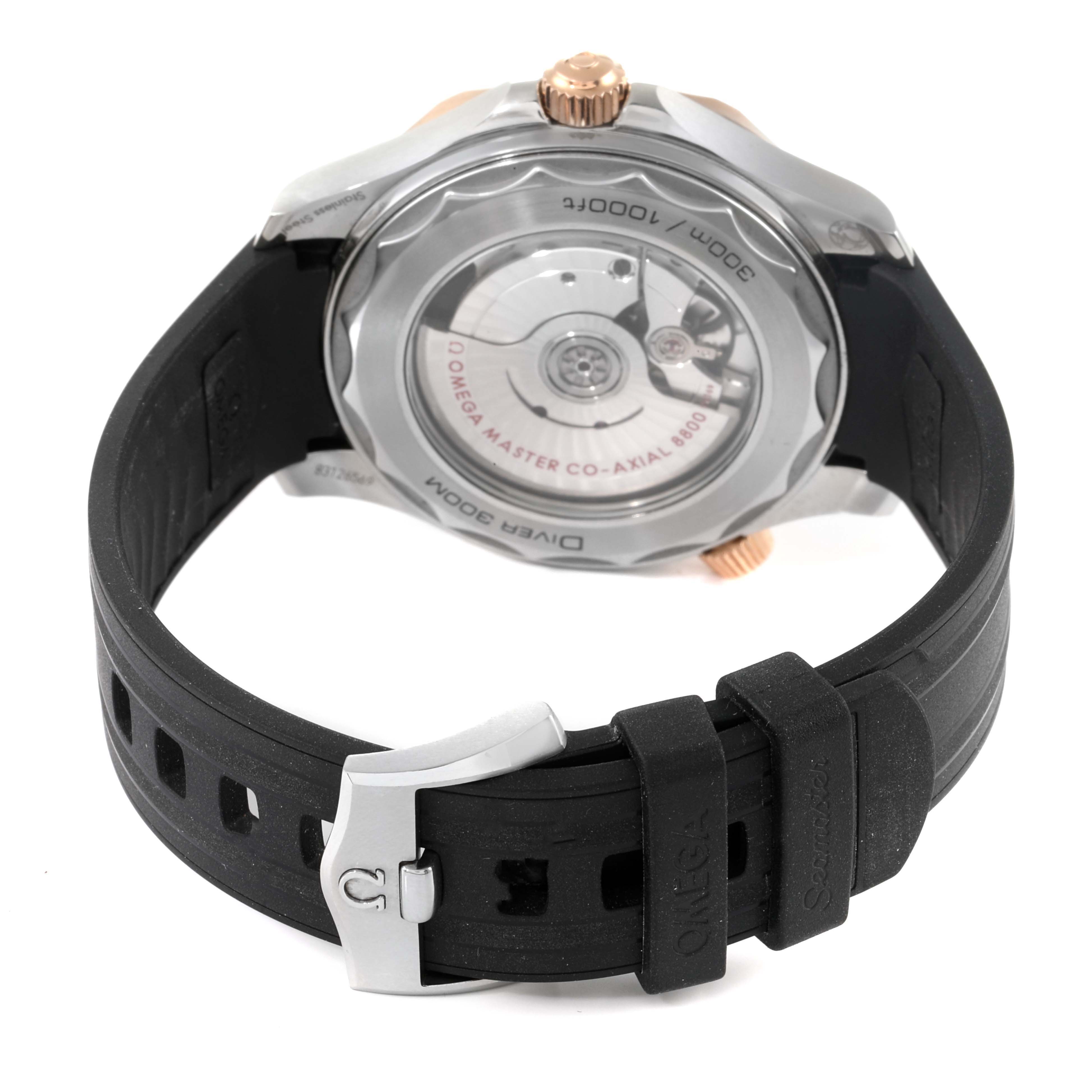 This image shows the backside of the Omega Seamaster 210.22.42.20.01.002 Men's Steel and Gold (two tone) Black Dial 210.22.42.20.01.002 Men's Steel and Gold (two tone) Black Dial watch, highlighting its automatic movement and black rubber strap.