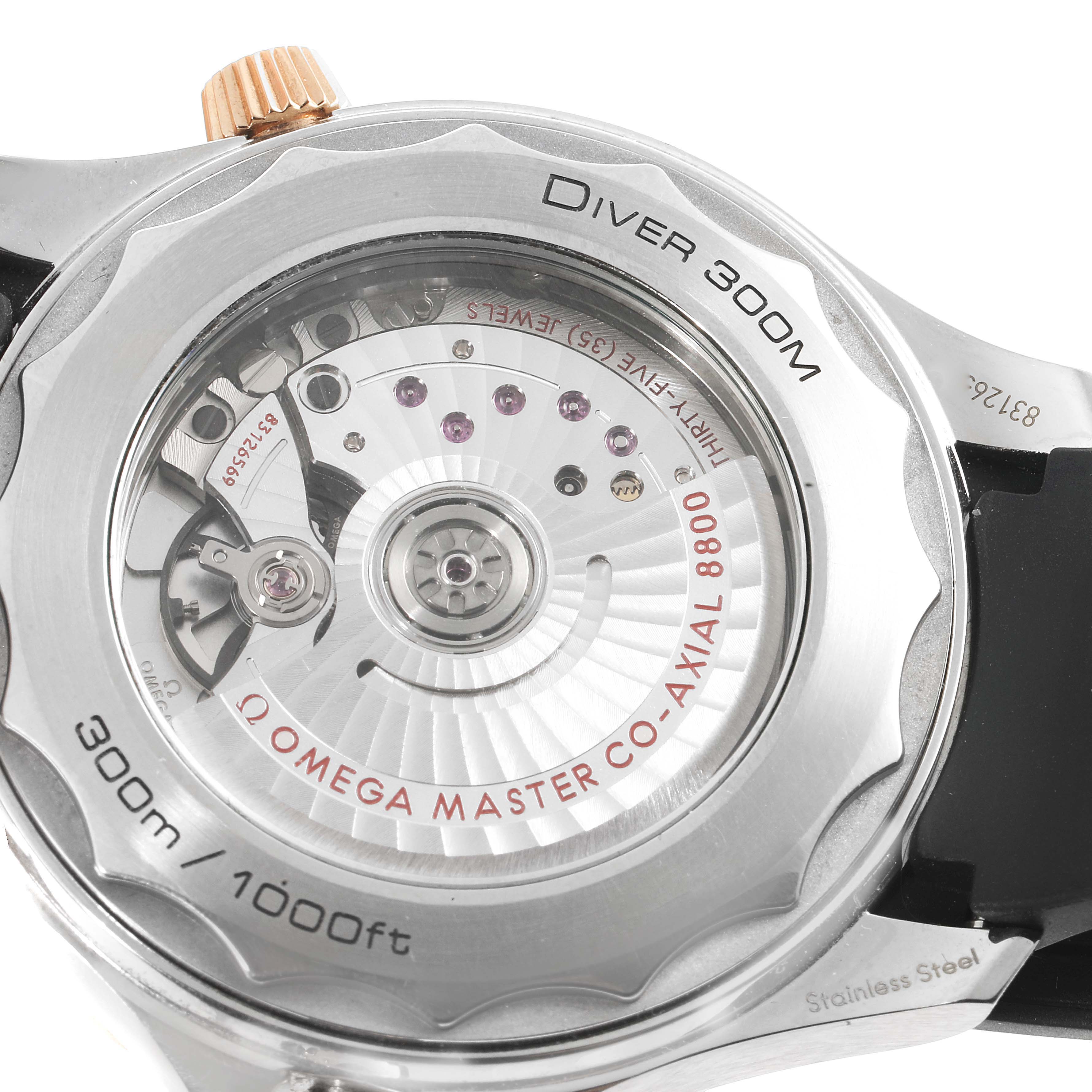 The image shows the back view of an Omega Seamaster 210.22.42.20.01.002 Men's Steel and Gold (two tone) Black Dial 210.22.42.20.01.002 Men's Steel and Gold (two tone) Black Dial Diver 300M, focusing on its visible mechanical movement.