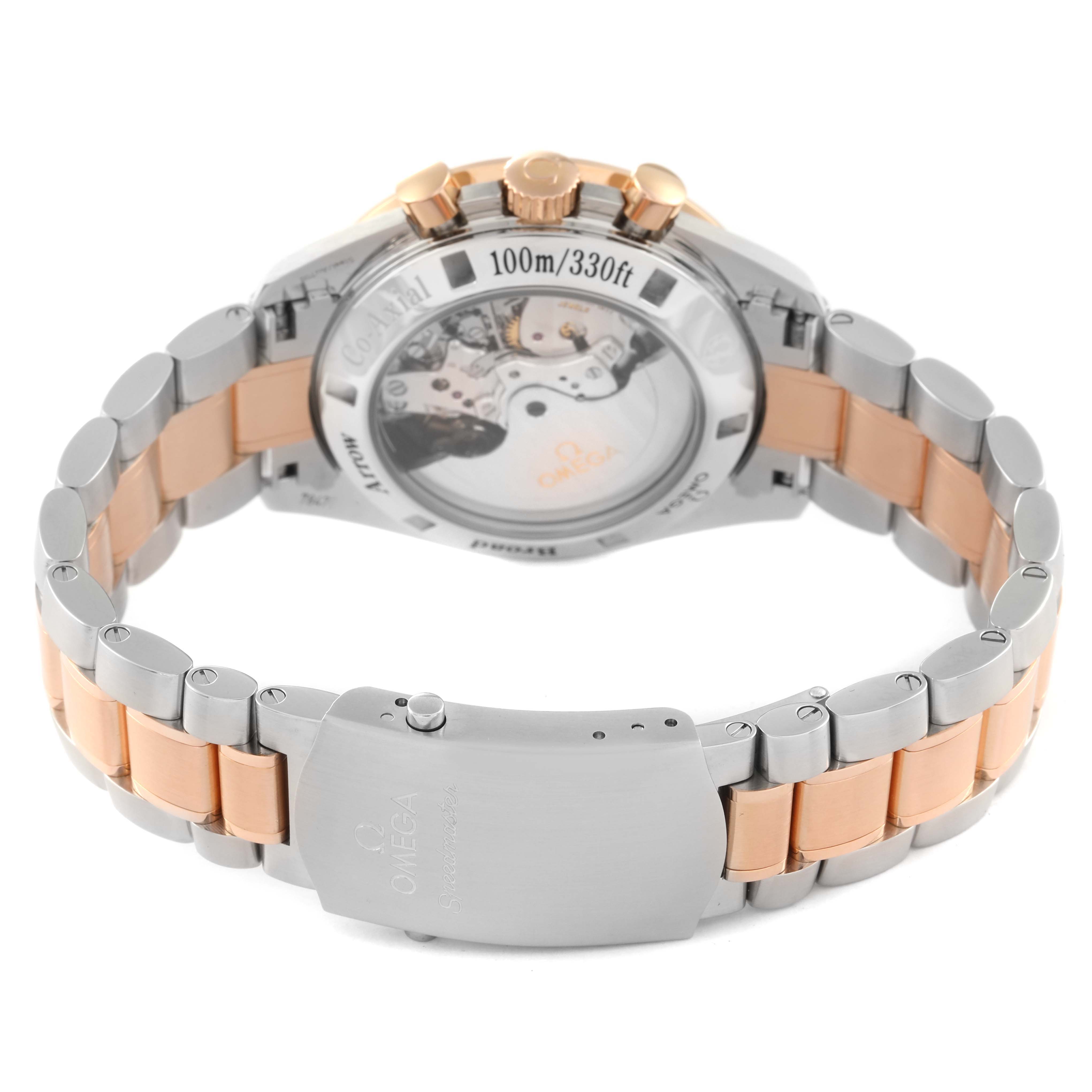 This image shows the back case and bracelet of an Omega Speedmaster 321.90.42.50.13.001 Men's Steel and Gold (two tone) Brown Dial 321.90.42.50.13.001 Men's Steel and Gold (two tone) Brown Dial with a view of its automatic movement and a two-tone metal bracelet.