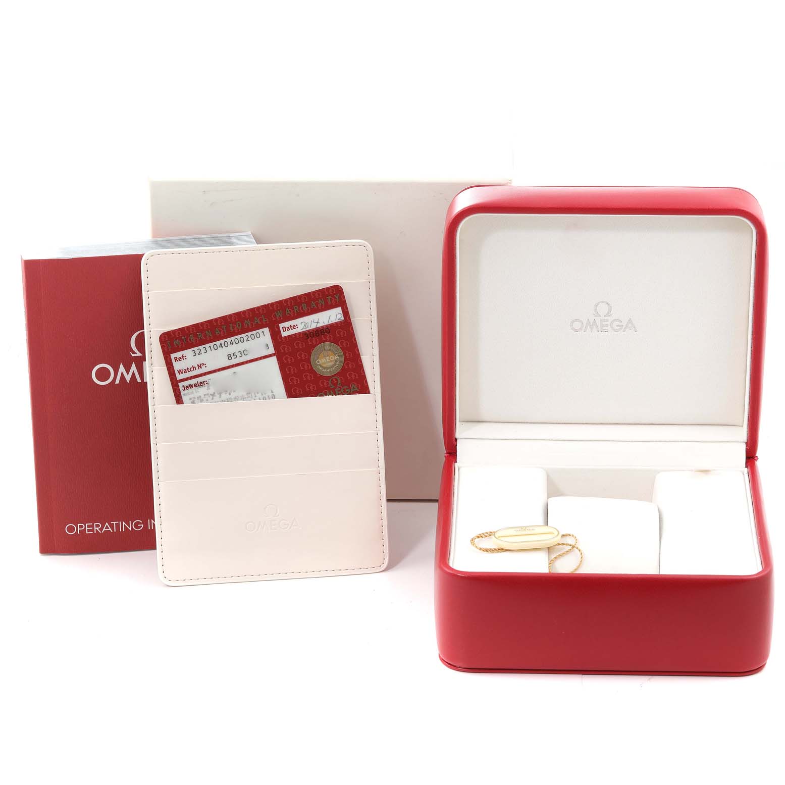 The image shows the packaging and accessories for an Omega Speedmaster 323.10.40.40.02.001 Men's Stainless Steel Silver Dial 323.10.40.40.02.001 Men's Stainless Steel Silver Dial, including a red watch box, warranty cards, and a user manual.