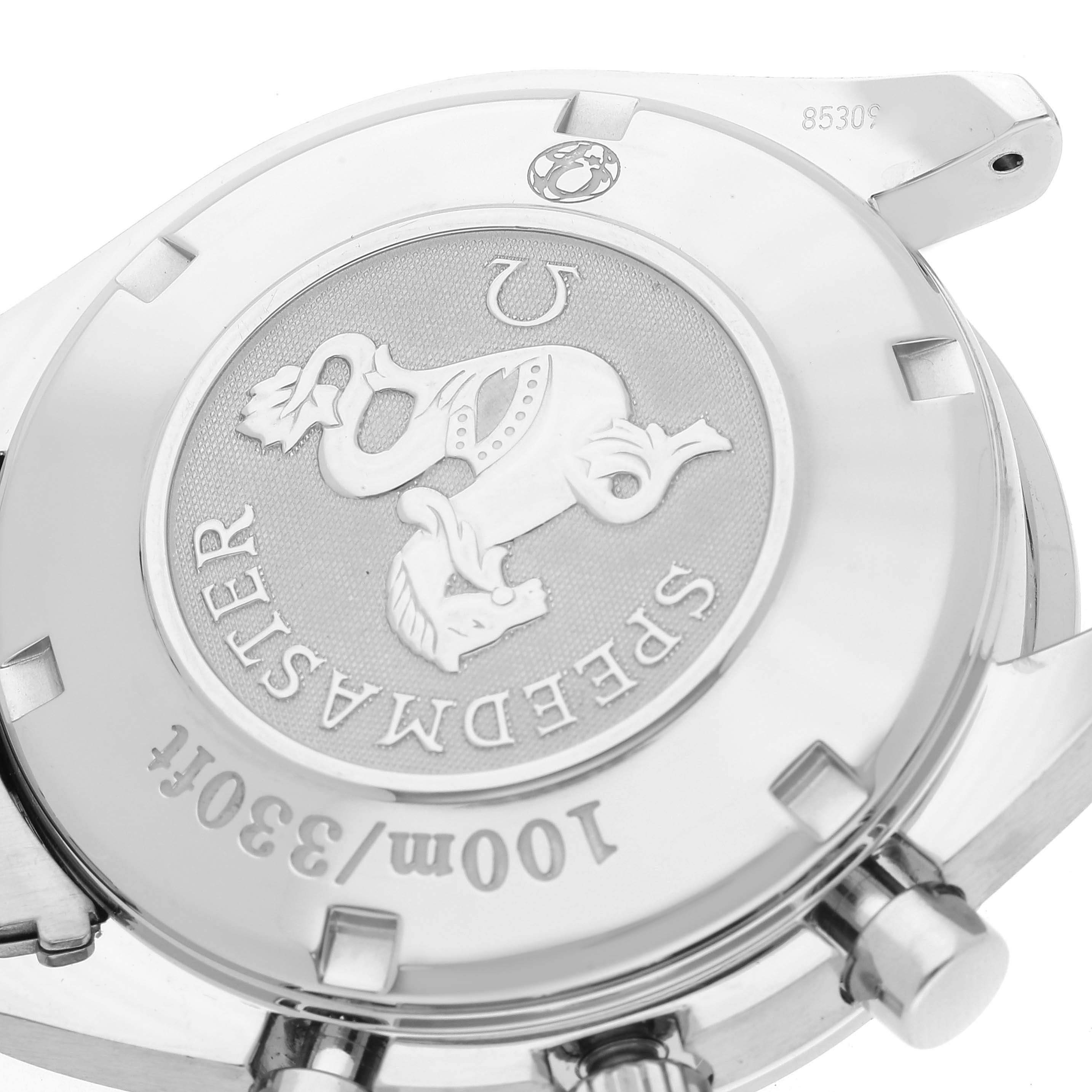 The image shows the back case of an Omega Speedmaster 323.10.40.40.02.001 Men's Stainless Steel Silver Dial 323.10.40.40.02.001 Men's Stainless Steel Silver Dial watch, showcasing its emblem and model details.