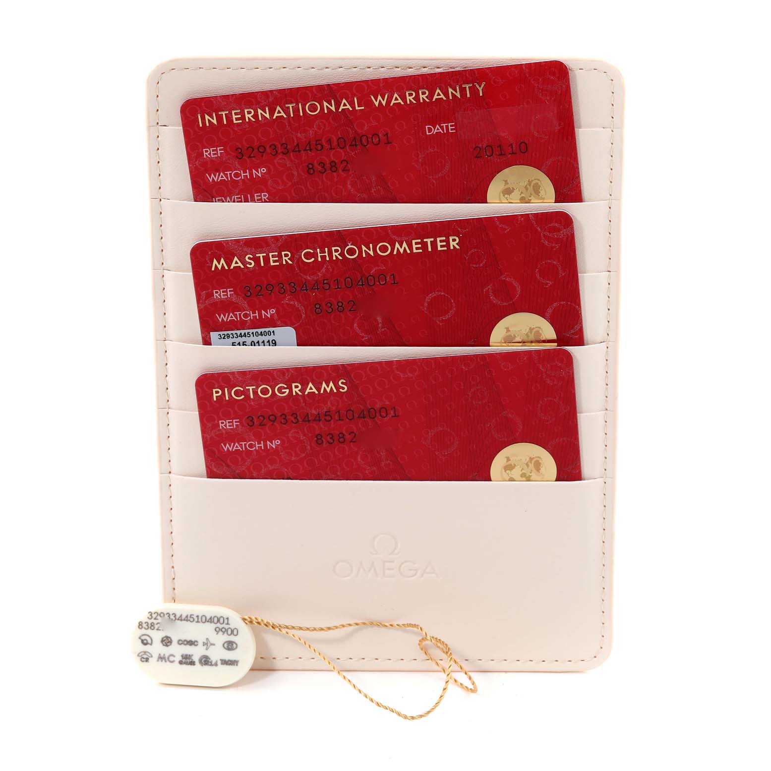 The image shows the warranty cards and a tag for an Omega Speedmaster 329.33.44.51.04.001 Men's Stainless Steel Silver Dial 329.33.44.51.04.001 Men's Stainless Steel Silver Dial watch in a holder.