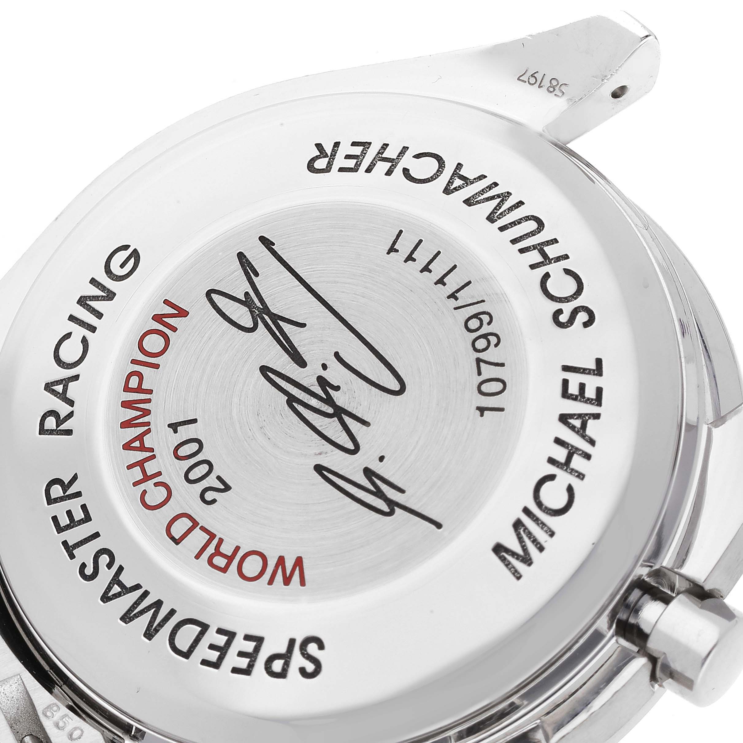 This image shows the engraved case back of an Omega Speedmaster 3519.50.00 Men's Stainless Steel Black Dial 3519.50.00 Men's Stainless Steel Black Dial Racing watch, highlighting commemorative text and signatures.