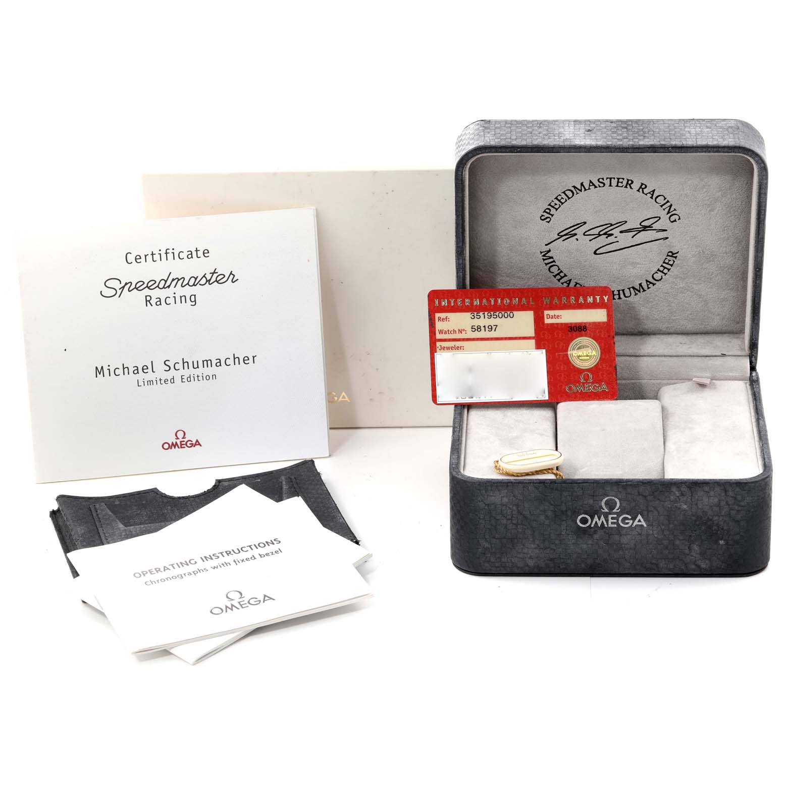 This image shows the packaging, warranty card, certificate, and instructions for an Omega Speedmaster 3519.50.00 Men's Stainless Steel Black Dial 3519.50.00 Men's Stainless Steel Black Dial Michael Schumacher Limited Edition watch.