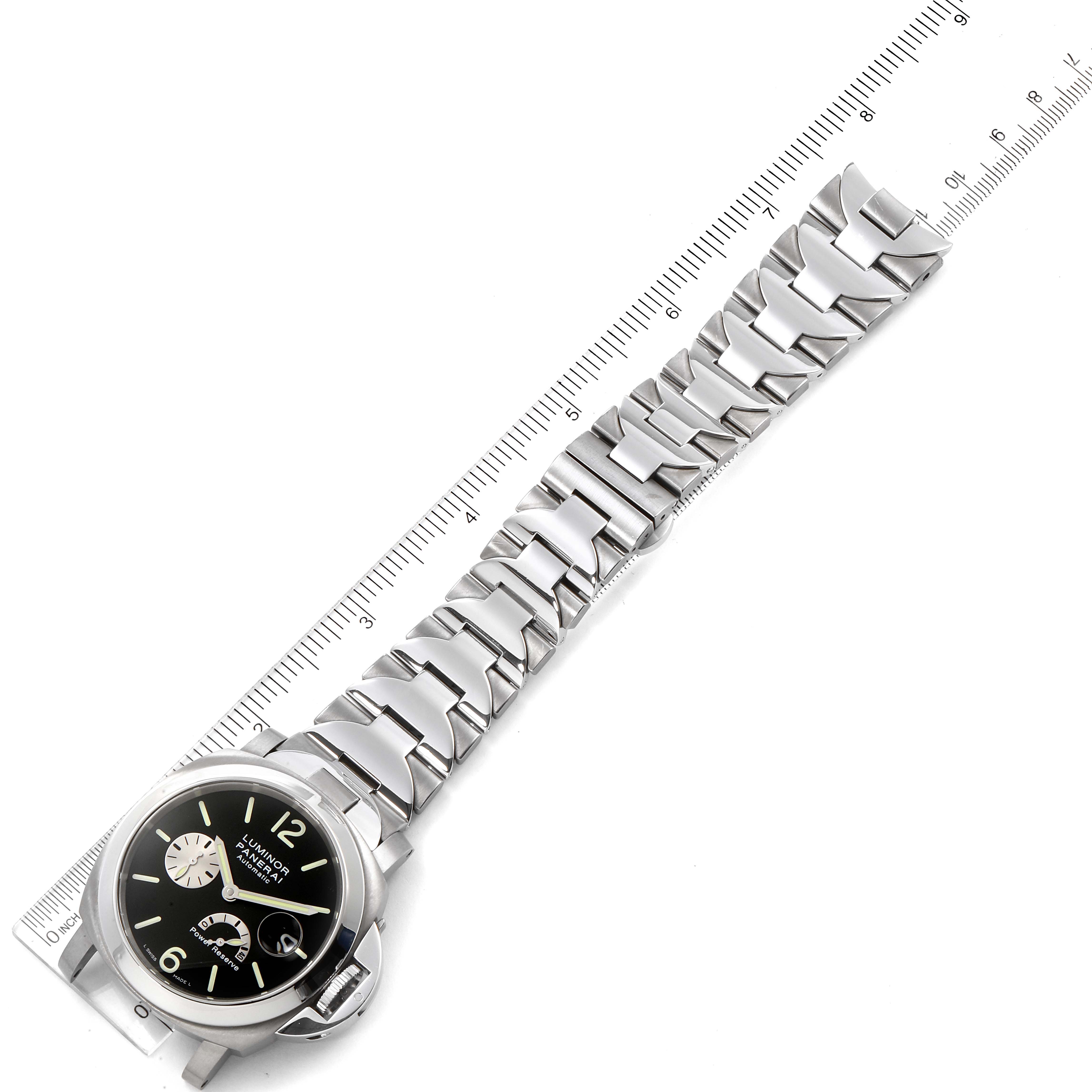 The image shows a Panerai Luminor PAM00171 Men's Titanium Black Dial PAM00171 Men's Titanium Black Dial watch laid flat with its metal bracelet extended next to a ruler, viewed from above.