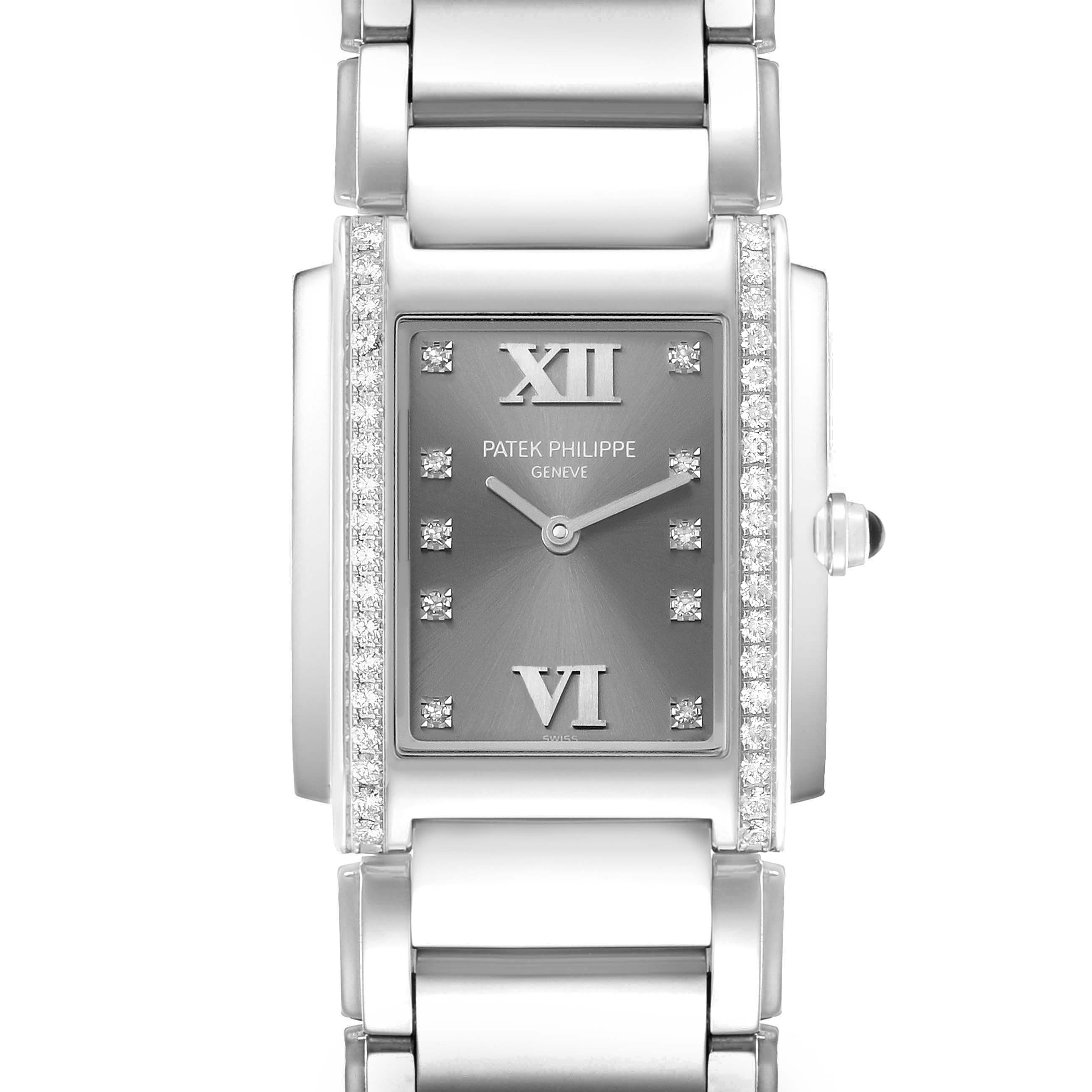 The image shows a frontal view of the Patek Philippe Twenty-4 4910/10A-010 Womens Stainless Steel Grey Dial watch, highlighting its face, bracelet, and diamond accents.