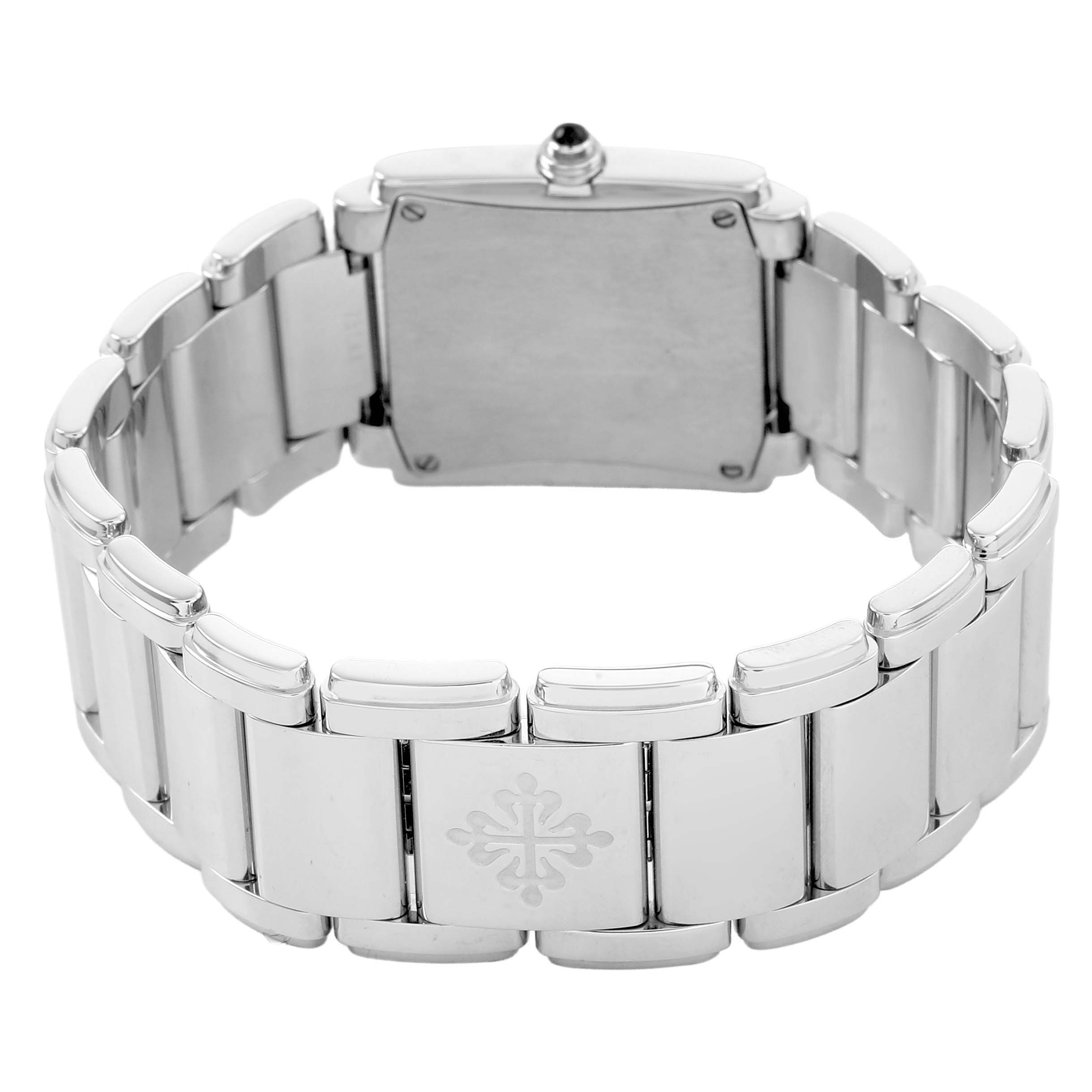 The image shows the back view of the Patek Philippe Twenty-4 4910/10A-010 Women's Stainless Steel Grey Dial watch, highlighting the clasp and bracelet.