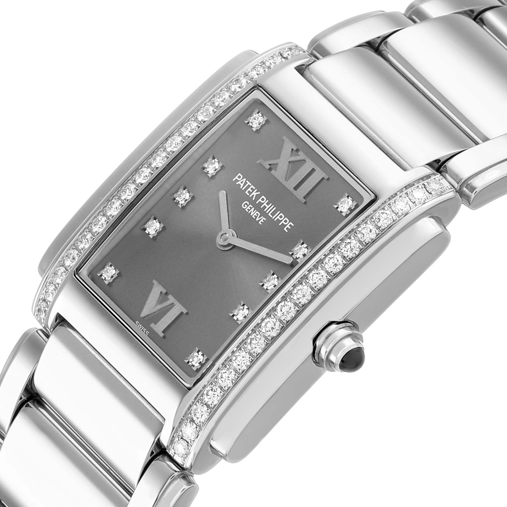 The Patek Philippe Twenty-4 4910/10A-010 Women's Stainless Steel Grey Dial watch is shown at an angled view, highlighting the bracelet, diamond-set bezel, and crown.