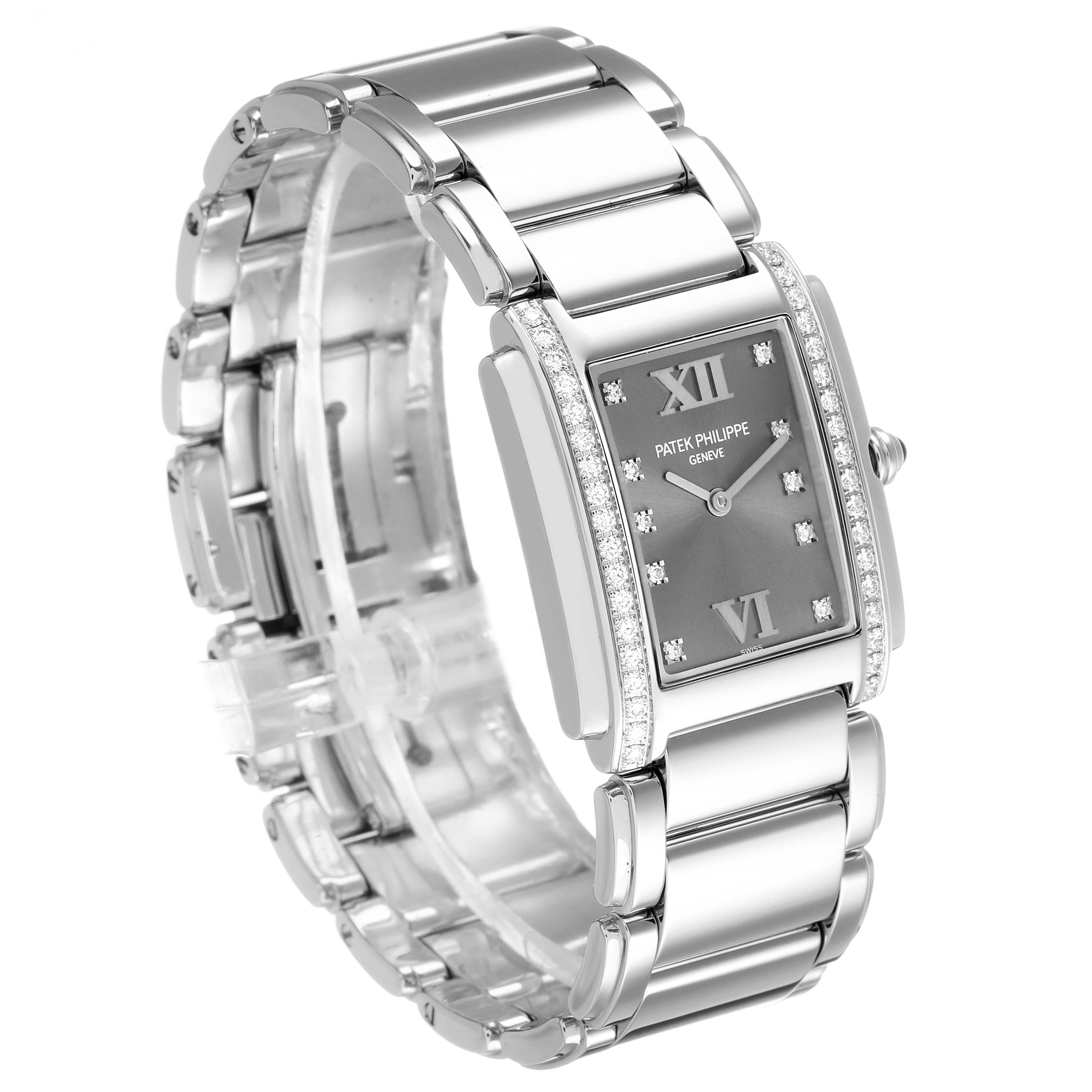 The Patek Philippe Twenty-4 4910/10A-010 Women's Stainless Steel Grey Dial watch is angled to show its rectangular face, diamond-set bezel, and polished metal bracelet.