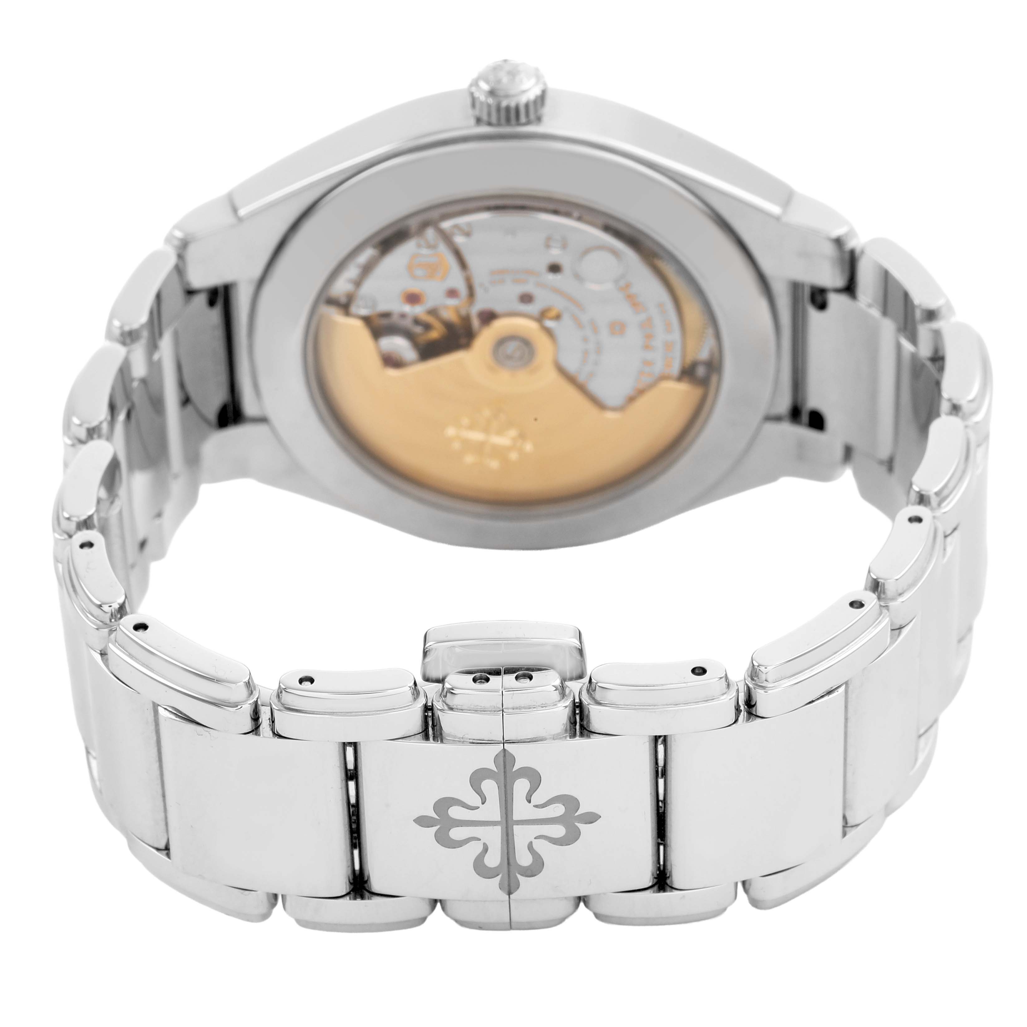 The image shows the back view of a Patek Philippe Twenty-4 7300/1200A-011 Women's Stainless Steel Green Dial watch, highlighting the movement and bracelet details.