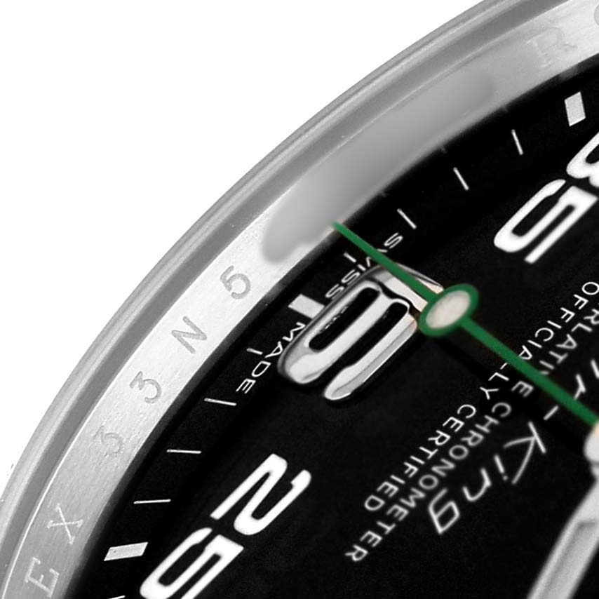 The image shows a close-up of the Rolex Air-King 116900 Men's Stainless Steel Black Dial watch's dial, including the bezel, hour markers, and green second hand.