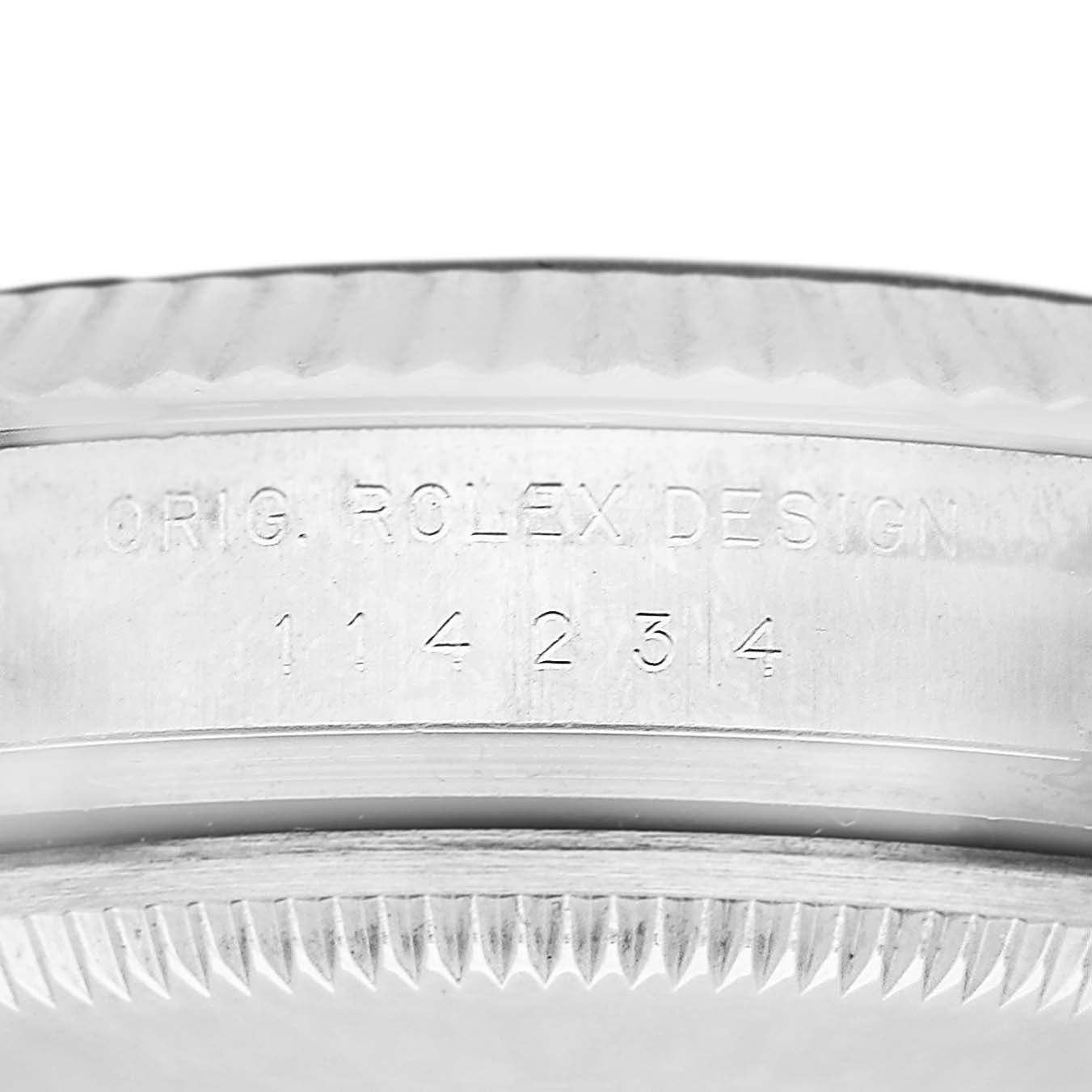 The image shows the side view of the bezel and case edge of a Rolex Air-King 114234 Men's Stainless Steel Blue Dial, highlighting the engraved model number.