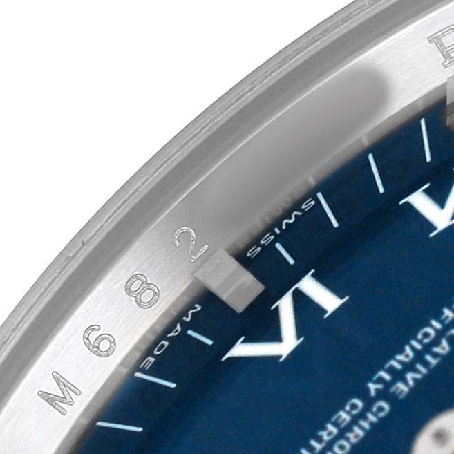 This close-up image shows the bezel and part of the dial with Roman numerals on the Rolex Air-King 114234 Men's Stainless Steel Blue Dial watch.