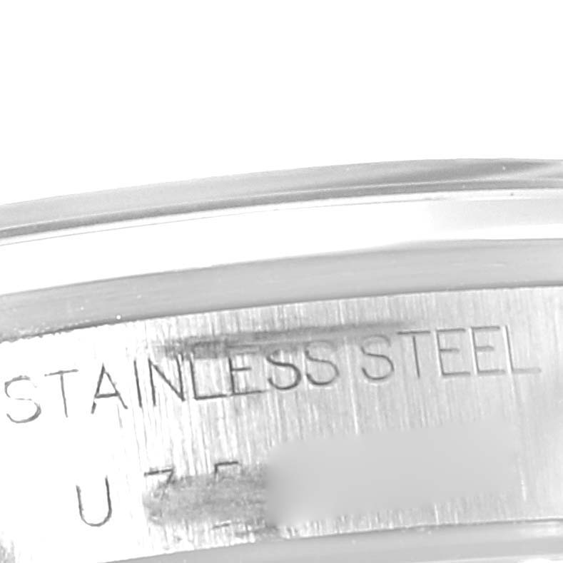 This image shows a close-up of the side edge of a Rolex Date 15200 Men's Stainless Steel Black Dial 15200 Men's Stainless Steel Black Dial model watch, featuring the stainless steel marking.