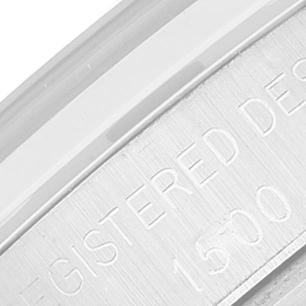 This image shows a close-up angle of the case back edge and engraved text of the Rolex Vintage Collection 1500 Men's Stainless Steel Silver Dial 1500 Men's Stainless Steel Silver Dial model.