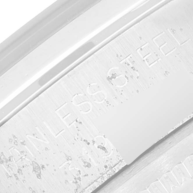 The image shows a close-up of the inner part of the case back of a Vintage Collection model by Rolex, displaying the "STAINLESS STEEL" engraving.