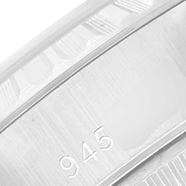The image shows a close-up of the casing of a Rolex Date 69240 Women's Stainless Steel Silver Dial 69240 Women's Stainless Steel Silver Dial model watch, featuring part of the serial number.