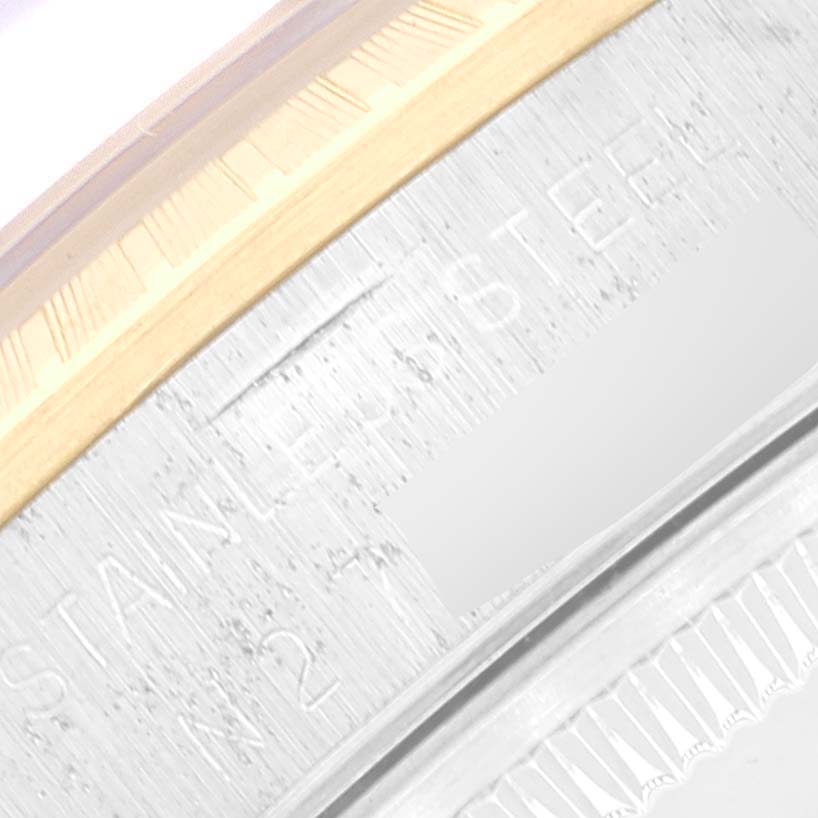 The image shows a close-up of the side of a Rolex Date 15223 Men's Steel and Gold (two tone) Black Dial 15223 Men's Steel and Gold (two tone) Black Dial model watch, highlighting the stainless steel and part of the bezel.