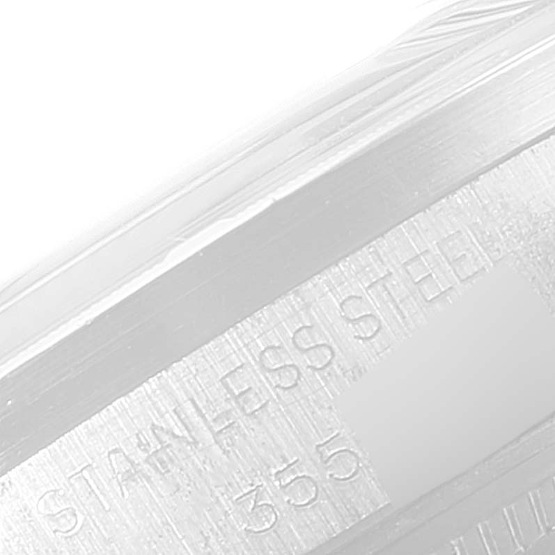 The image shows a close-up angle of the case side of a Vintage Collection Rolex watch, highlighting its stainless steel engraving.