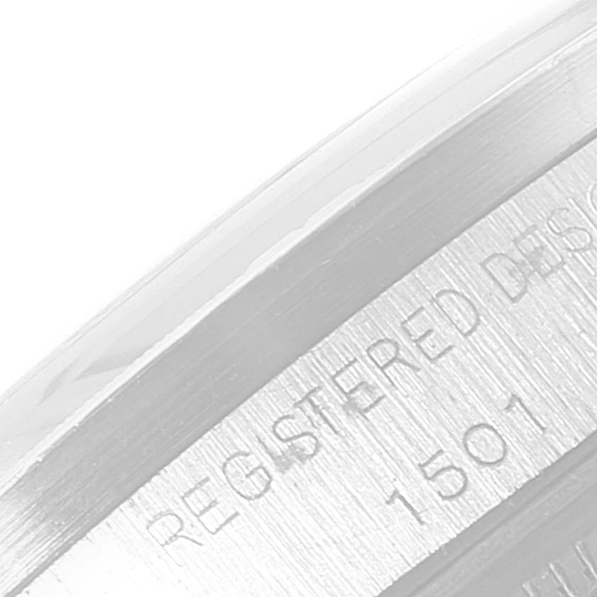 The image shows a close-up of the side view of the bezel or case edge of a Vintage Collection model by Rolex, featuring engraved text and numbers.