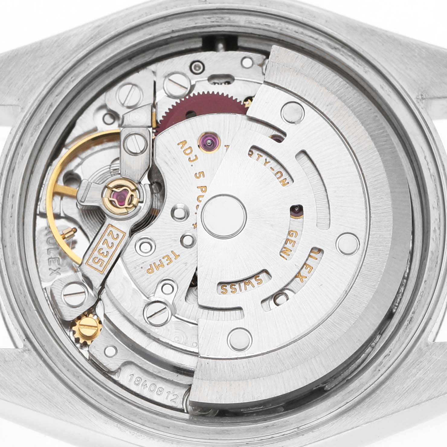 The image shows the movement of a Rolex Datejust 79174 Women's Stainless Steel White Dial watch from a back view, highlighting gears and the oscillating weight.