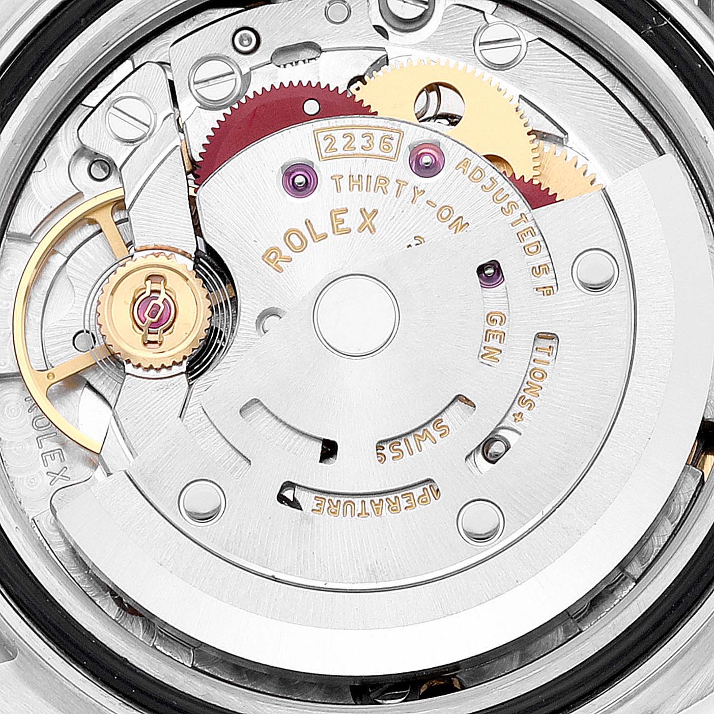 This image shows a close-up view of the movement inside a Rolex Datejust 279174 Women's Stainless Steel Grey Dial 279174 Women's Stainless Steel Grey Dial watch, highlighting the gears and intricate mechanisms.