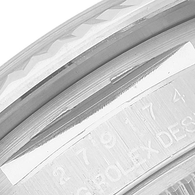 The image shows a close-up angle of the Rolex Datejust 279174 Women's Stainless Steel Grey Dial 279174 Women's Stainless Steel Grey Dial's engraved bezel and case edges.