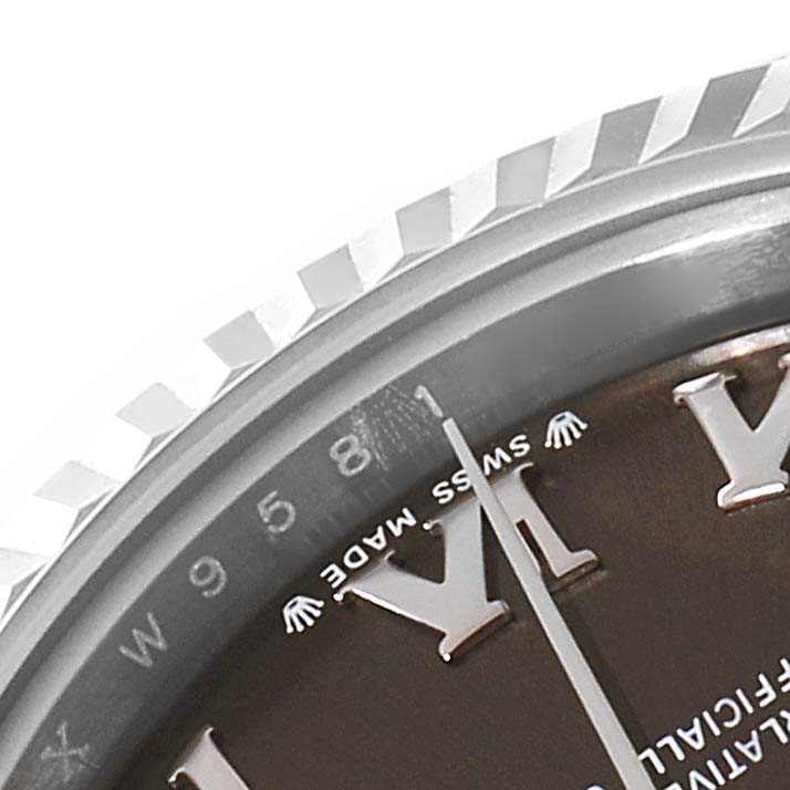 This close-up shows a portion of the dial and fluted bezel of a Rolex Datejust 279174 Women's Stainless Steel Grey Dial 279174 Women's Stainless Steel Grey Dial watch, highlighting the "Swiss Made" text.