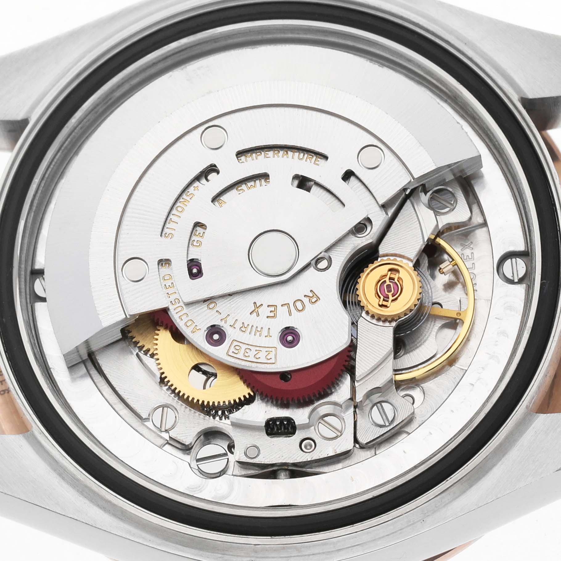 The image shows the back view of a Rolex Mid-Size M278341RBR-0016 Women's Steel and Gold (two tone) Silver Dial watch, highlighting the movement and internal mechanics.